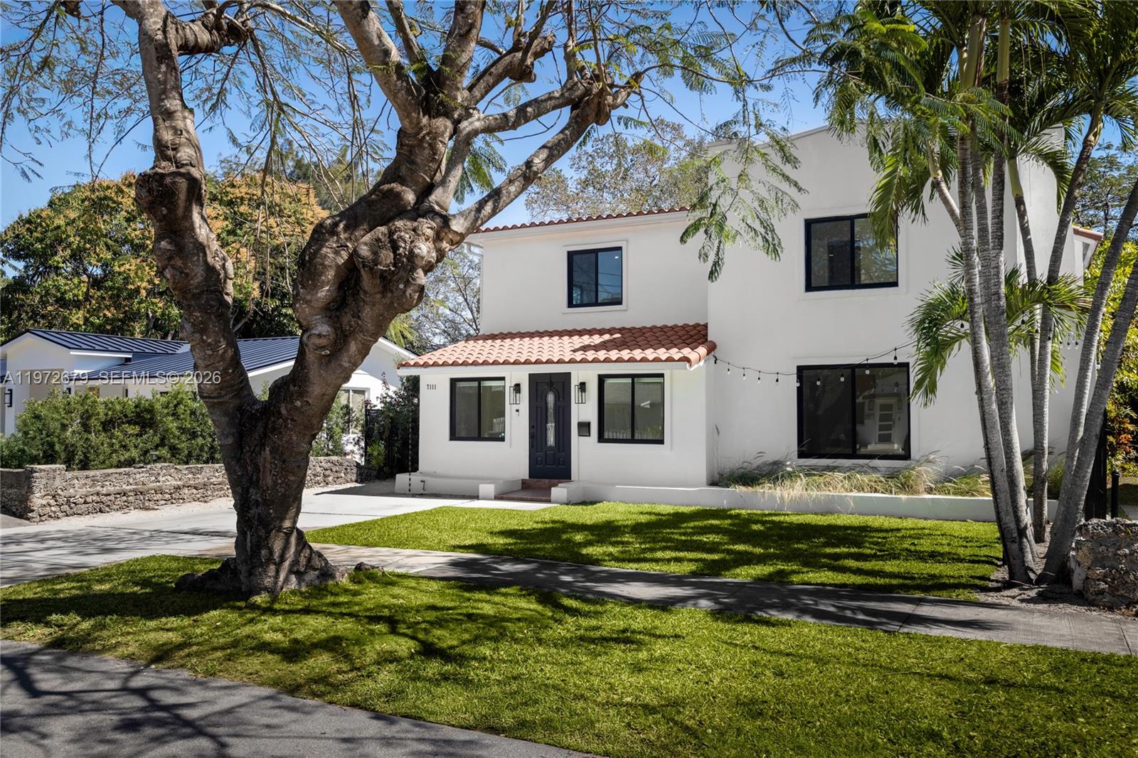 A South Miami home that checks all our favorite boxes – renovated, charming, walkable, with a pool – for under $1.85M! This reimagined Old Spanish home is turnkey and ready to welcome its new chapter. Walk to top restaurants and boutiques or lounge at home in inviting indoor and outdoor spaces. Sunlight spills into warm, open living areas including family room with picture window, formal dining room, large foyer, and living room with original fireplace. The kitchen offers room for a breakfast area plus access to the lush backyard, terrace, and pool with spa. Enjoy the same tropical view from a private balcony off your generous primary suite with vaulted ceiling and walk-in closet. New septic tank and drain field, impact windows/doors throughout, and 2021 roof add substance to style here. Some photos virtually staged.