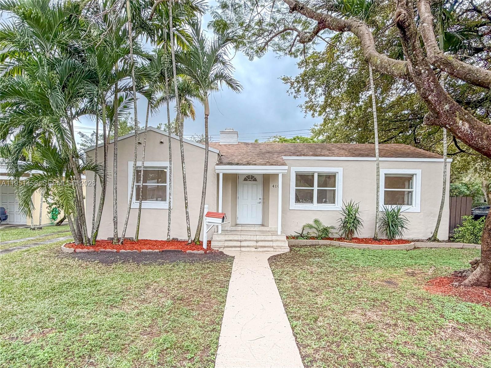Located on Pinecrest Dr in Miami Springs, steps from Downtown Miami Springs and minutes to the Miami Springs Golf and Country Club, this corner lot home offers charm, space, and true flexibility. The main residence features four bedrooms and two bathrooms, plus a separated rear one bedroom one bathroom quarters designed for privacy and independent use, ideal for extended family, guests, or a private home office. A standout value add is the smart utility setup, including separate energy monitoring for the main home and the rear quarters with phone based appliance level tracking, plus exterior water meters to help allocate usage with clarity. Smart home ready features support remote lighting control. Set on an eight thousand eight hundred forty three square foot lot with room for a pool and future expansion. No HOA. Space may accommodate boat or RV parking.