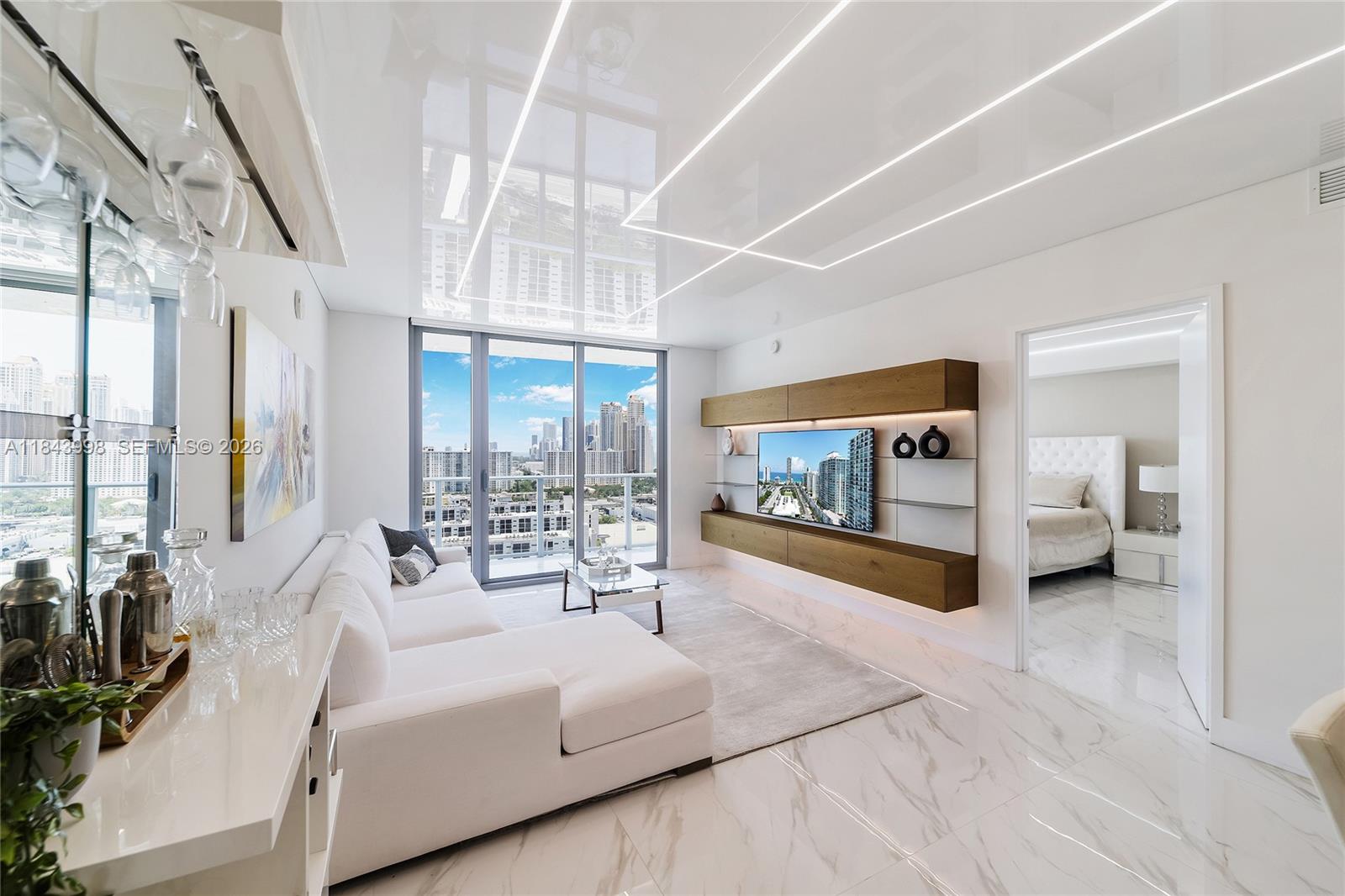Step into luxury with this stunning 2-bedroom plus den, 3-bathroom condominium located on the 22nd floor in Sunny Isles Beach. This exquisite condo unit offers breathtaking views of the city, ocean, and intracoastal waterways. Impeccably upgraded throughout, this residence boasts an elegant open-concept layout enjoying spacious living areas and a private balcony perfect for soaking in the spectacular vistas. Seamlessly combining elegance with comfort, it provides the ideal backdrop for a sophisticated lifestyle. Enjoy the convenience of modern amenities, including exclusive beach access to SOLE BEACH CLUB and the tranquility of a prestigious community, all while being just minutes from pristine beaches, fine dining, world class shopping, entertainment and more. Your dream residence awaits!