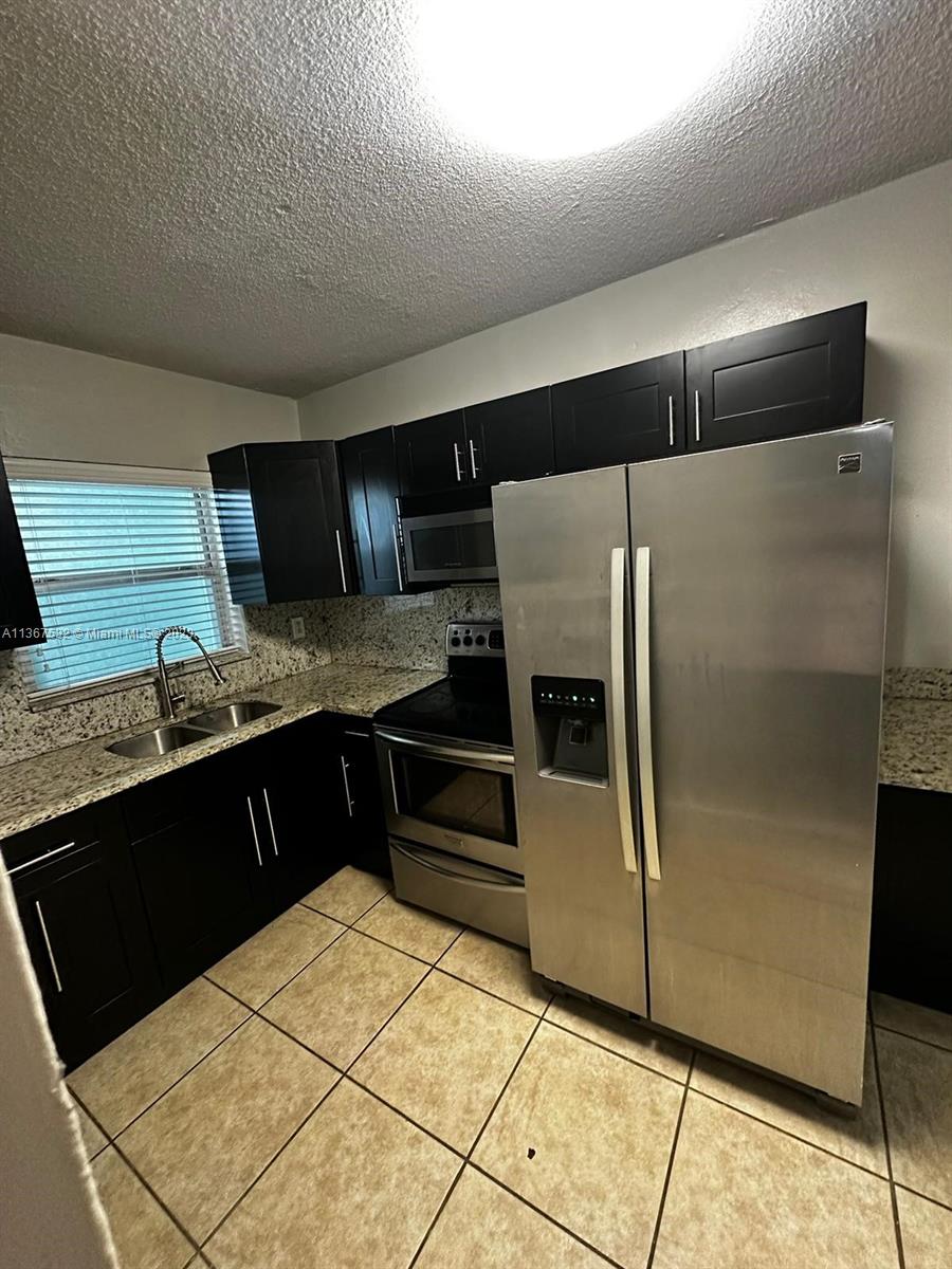 Rental Opportunity in the Heart of Hialeah. 1 bedroom , 1 bath apartment recently remodeled at Garzan Condo. Very nice Kitchen, with Granite counter top and stainless steel appliances. Ceramic Tiles throughout for easy maintenance.  The  bedroom has wall to wall his and hers closets. Additional storage closet in the hallway.  First floor unit close to the pool and the laundry facilities. 1 Parking space assigned. Additional guest parking or street parking available.  Walking distance to Hialeah Hospital, Hialeah Race Track, groceries and stores.  Building is a boutique style building . Ready now. Vacant.  First, Last and security required. Assoc. approval takes 2-3 weeks to approve.  Offered at $1650.00 monthly. Yearly Lease required.