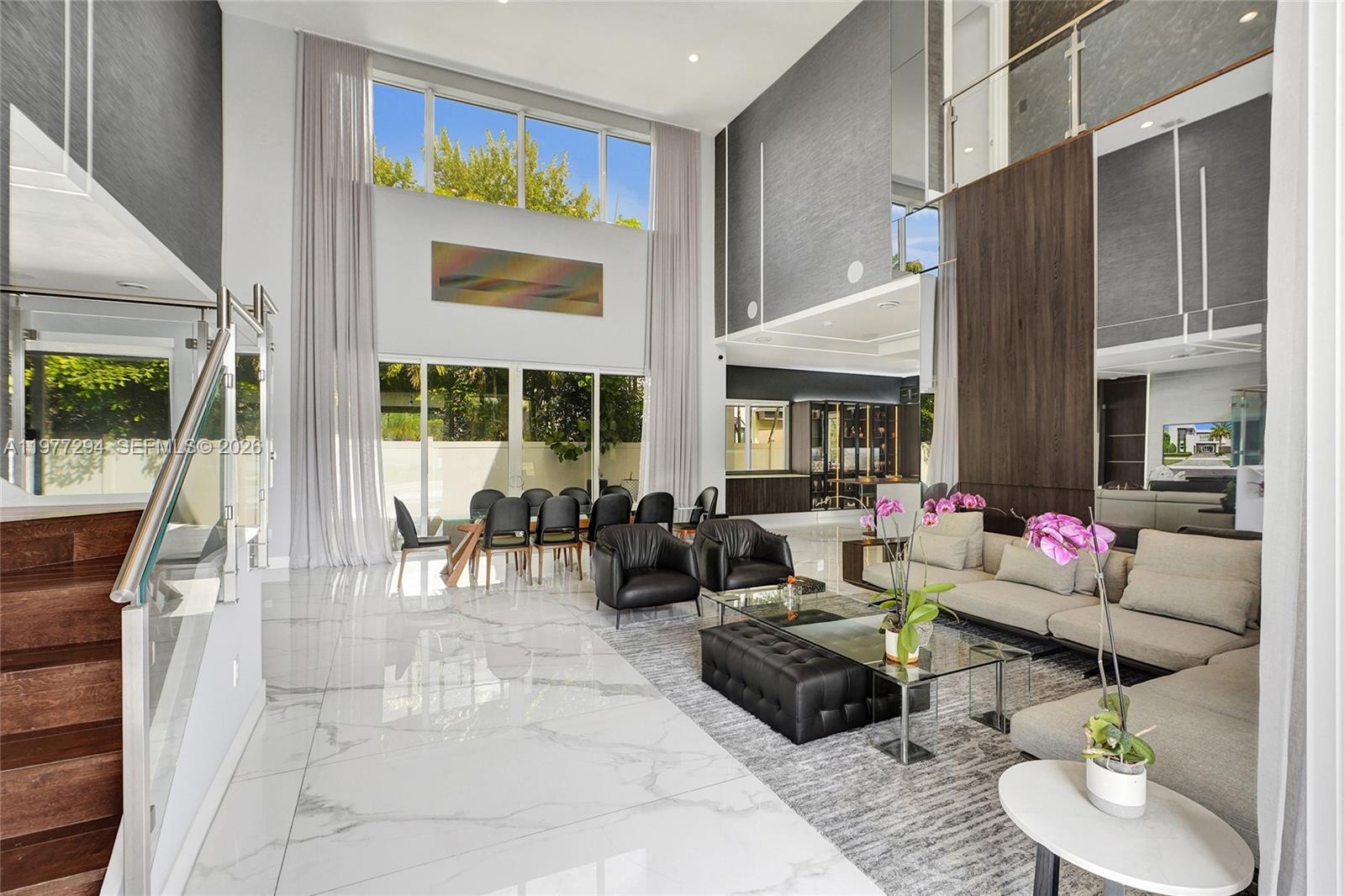 Step into elegance with this stunning corner-lot estat in the exclusive gated community of Modern Doral 75! This 5-bedroom, 5.1-bathroom masterpiece is designed for those who crave space, sophistication, and resort-style living. Features Include: OPEN FLOOR plan, 1 bedroom & 2 bath on the first floor and elegant interior architectural details, high ceiling, impact window & doors, Porcelanato floors on 1st floor and Wood Floors on 2nd floor and stairs, SMART HOME, Italian cabinetry, quartz counter tops and top of the line Stainless Steel appliances, AUTOMATIC CURTAINS and BLINDS, unique LIGHTING DESIGN, full SURROUND SYSTEM, game room, GAZEBO with BUILTIN BBQ. Club house with meeting areas, a fully equipped fitness center and children's playroom, media room and kitchenette, swimming pool, spa, sun deck, gazebo area and more.  Community Perks:Exclusive clubhouse with resort-style pool, Kids’ playroom & entertainment spaces, State-of-the-art fitness center, 24/7 gated security