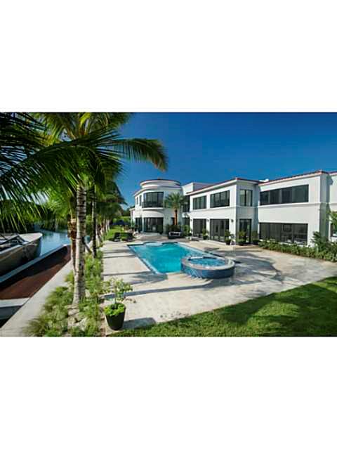 INCREDIBLE OPPORTUNITY! This exquisitely built home feels like a private estate with an impressive water frontage of 300'.Two minute walk from the ocean,Faena District, Edition Hotel, & top restaurants. This 6700 sq ft home offers 6BR/7.5BA, gourmet/koshe r kitchen, staff quarters, grand formal rooms, & a GIGANTIC master bedroom - featuring 13' ceilings, private office, 2 balconies, walk in closet, & jacuzzi. Separate guest home offers master suite & gym. Resort style pool, infinity hot tub, private dock.