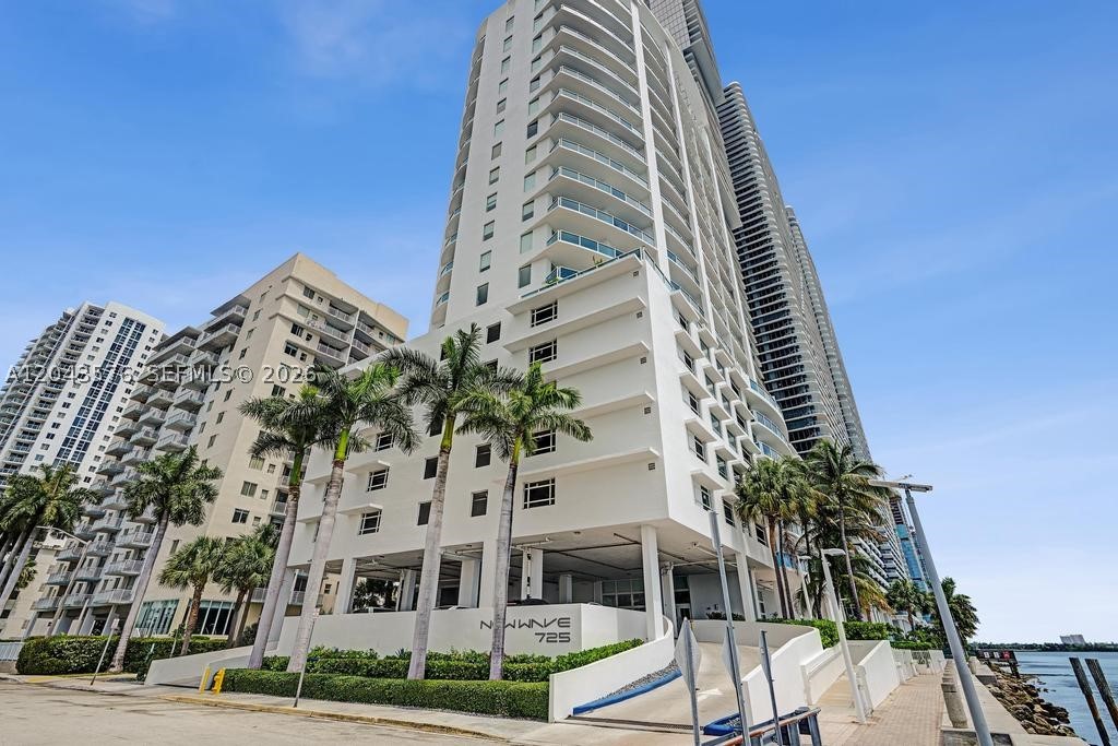 Stunning direct bay views from every room! This spacious 1BD/1BA residence offers approx. 850 SF of interior living space plus a large private waterfront terrace in a boutique building right on the bay. Features include 10-ft ceilings, impact-resistant sliding glass doors opening to an oversized terrace, granite countertops, stainless steel appliances, ceramic floors, and in-unit washer/dryer. Assigned parking included. Building amenities: heated pool, fitness center, and elevator. East exposure ensures exceptional natural light and unobstructed bay views all day. Excellent opportunity to own a waterfront residence in the heart of Edgewater.