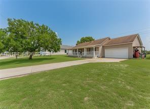 Charming home in a rapidly growing neighborhood, perfectly situated in the sought-after West Glades School District and just minutes from the Port LaBelle Marina. Enjoy a classic old-fashioned front porch, new flooring throughout, newer appliances and fixtures, a finished attic for storage or other uses, a 50-amp breaker for RV's with septic and water hookup and there is also a backyard shed for extra storage.