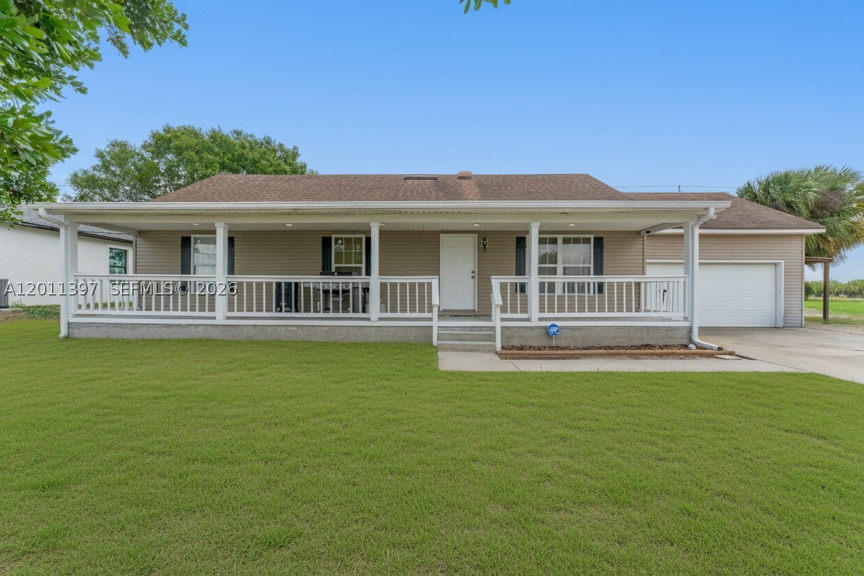 ONLY ABOUT A 1.5 HOUR DRIVE FROM MIAMI, YOU WILL FIND AFFORDABLITY! Move-in ready, this inviting home is set in a fast-growing neighborhood near the Port LaBelle Marina and within the highly desirable West Glades
School District. A classic front porch welcomes you in, while new flooring throughout, updated appliances and fixtures, and a versatile, finished
attic add comfort and function. Outside, the property is equipped with a 50-amp RV hookup complete with septic and water connections, plus a
backyard shed for extra storage. Full of character and practical upgrades, this home is ready for its next owner.