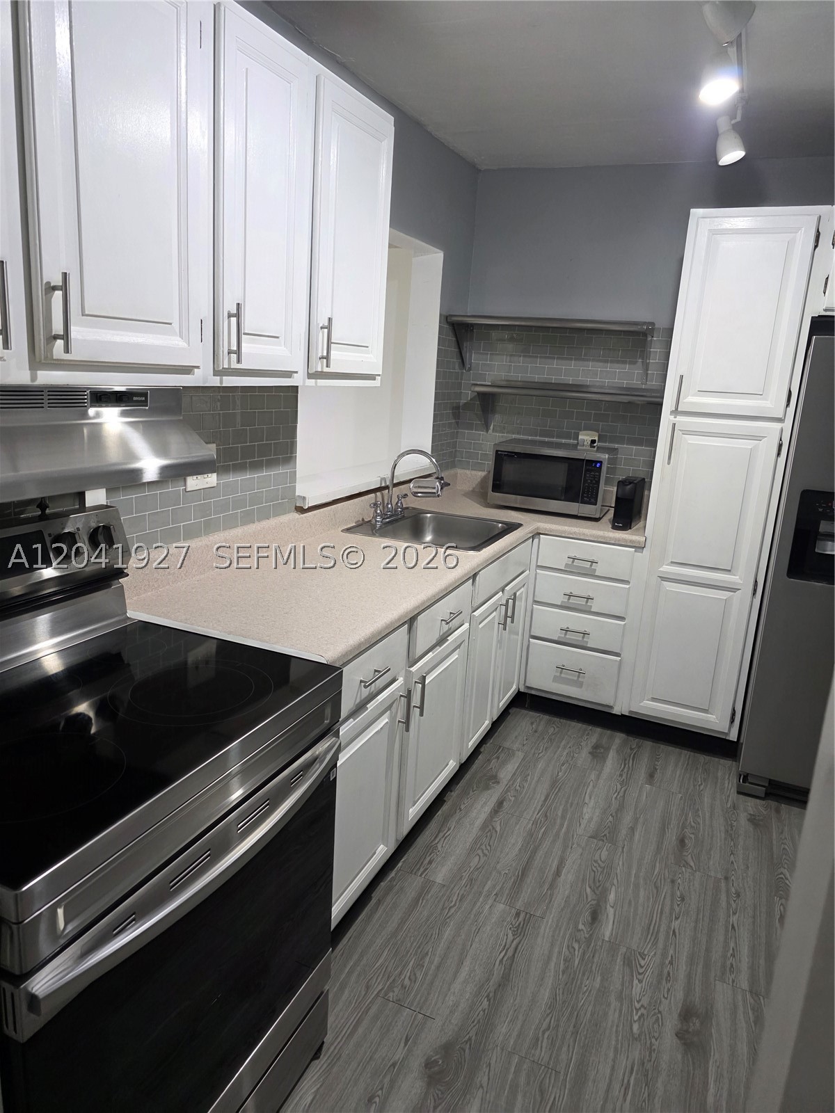 VERY SOUGHT AFTER HORIZONS (EAST) CONDO, 2 BEDROOMS, 2 BATHS, ON 2ND FLOOR, REMODELED KITCHEN WITH STAINLESS STEEL APPLIANCES (STOVE & HOOD REPLACED, REFRIGERATOR REPLACED 2 YRS AGO, MICROWAVE ALSO REPLACED) NEWER BLACKSPLASH AND CABINET HANDLES ALSO REPLACED, 2 DOOR REFRIGERATOR WITH WATER/ICE DISPENSER, STAINLESS STEEL SHELVES IN KITCHEN, EXTRA PANTRY CABINET FOR MORE STORAGE, UPDATED MASTER BATH WITH SHOWER, NEW WATERPROOF FLOORING INSTALLED IN L/R, D/R, KITCHEN , HALLWAY, AND FOYER. WATERPROOF VINYL FLOORING INSTALLED ON BALCONY, SCREEN BALCONY WITH STORAGE ROOM, REPLACED A/C CONDENSING UNIT ON ROOF IN 2021, HORIZONS OFFERS GREAT AMENITIES: (3) POOLS, (4) TENNIS COURTS, BEAUTIFUL CLUBHOUSE, GYM, 24 HOUR GUARD AT GATE PLUS ROVING GUARD IN EVENING HOURS, LOTS OF GUESTS PARKING , PLUS (1) ASSIGNED PARKING SPACE, LAUNDRYROOMS ON EACH FLOOR (3)WASHING MACHINES AND (3) DRYERS PER FLOOR, BEAUTIFUL PARK ACCROSS THE STREET FROM HORIZONS (INDIAN HAMMOCKS PARK), BUILDING HAS COMPLETED AND PASSED THEIR 40 YEAR CERTIFICATION AND CONDO HAS RESERVES.