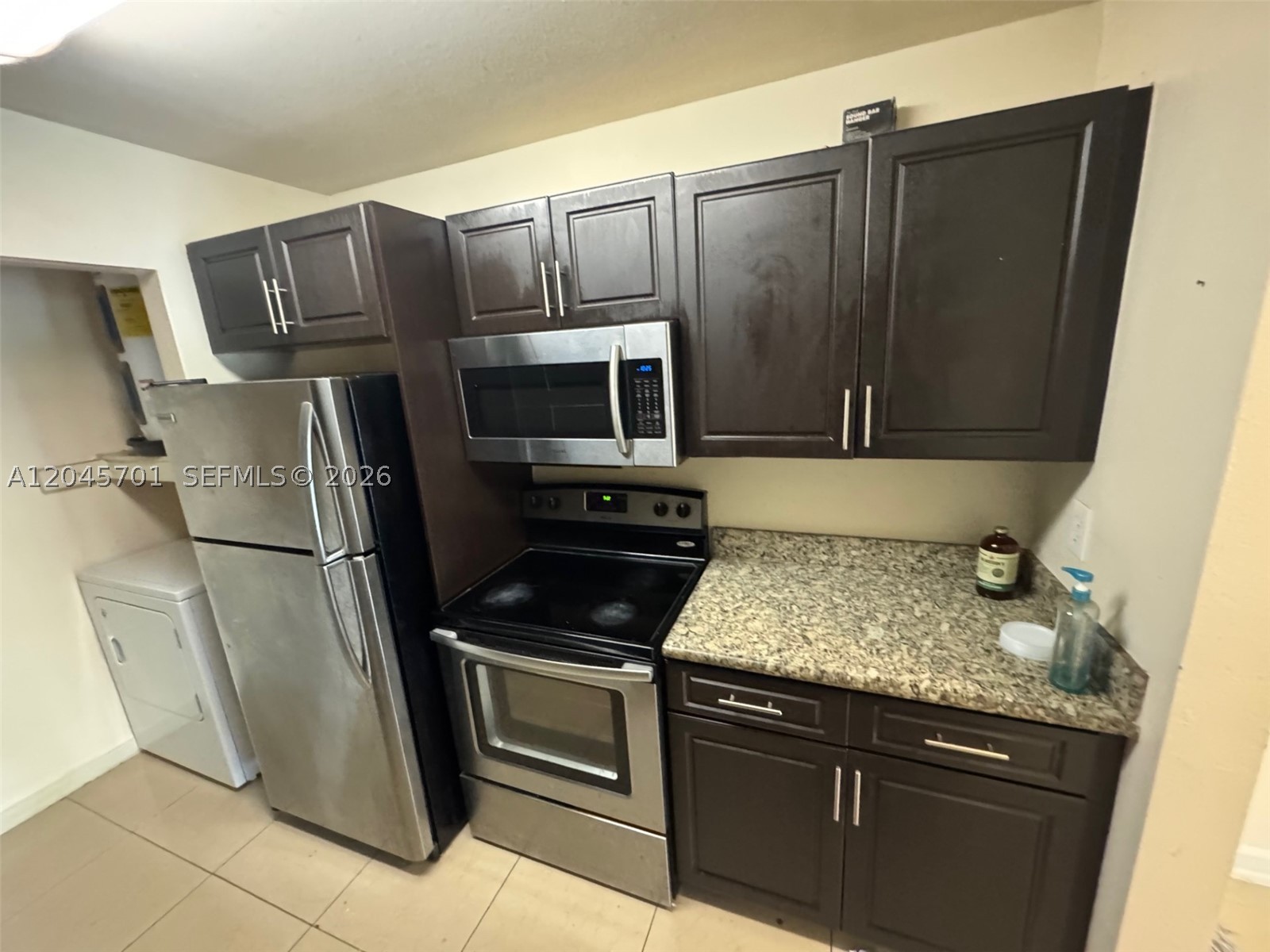 **INCREDIBLE INVESTOR OPPORTUNITY- CAN RENT IMMEDIATELY UPON PURCHASE- MARKET RENT IS UPWARDS OF $2200- INVESTOR FRIENDLY ASSOCIATION** THIS 2/2 CONDO ON THE TOP FLOOR WITH VAULTED CEILINGS IN LIVING ROOM OFFERS A SPACIOUS FLOORPLAN WITH UPDATED BATHROOMS AND A BEAUTIFUL SCREENED IN BALCONY OVERLOOKING THE LAKE. UPDATED KITCHEN W/ CHERRY WOOD CABINETS WITH GRANITE COUNTERTOPS, STAINLESS STEEL APPLIANCES (NEW STOVE AND WASHER RECENTLY REPLACED) & UNIT IS TILED THROUGHOUT. WASHER/DRYER INSIDE UNIT! EXCELLENT INVESTOR FRIENDLY COMMUNITY WITH POOL, GYM, PLAYGROUND, BASKETBALL COURT & CLUBHOUSE. NEAR SAWGRASS MALL, MAJOR HIGHWAYS AND SHOPPING!  Perfect for investors with no rental restrictions, quick approval, & strong rental demand in this popular community. Also ideal for first-time buyers or those looking to downsize. Enjoy resort-style amenities including a pool, gym, playground, basketball court, & plenty of guest parking. Prime Sunrise location directly across from shops