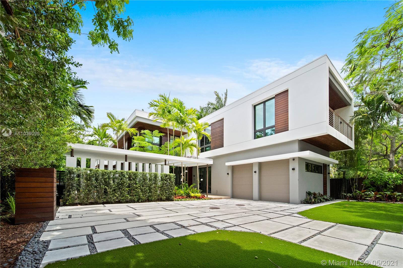 Surrounded by lush gardens and set behind a custom coral rock wall and gate, this tropical modern sanctuary is located in the heart of Coconut Grove.

Designed by the renowned architect, Charles Treister, this home boasts 23 ft ceilings and floor-to-ceiling windows that provide a seamless transition from indoor to outdoor living area.
 
The home features 7 bedrooms, 8 bathrooms, and 2 half bathrooms, including one bedroom and maid’s quarters located on the first floor. With a full smart home technology system, custom Italian kitchen, and wine cellar, no details were spared in this home.

Walking distance from some of the top schools in all of Florida; Carrollton, Ransom, and St. Stephens, as well as luxury dining and shopping.