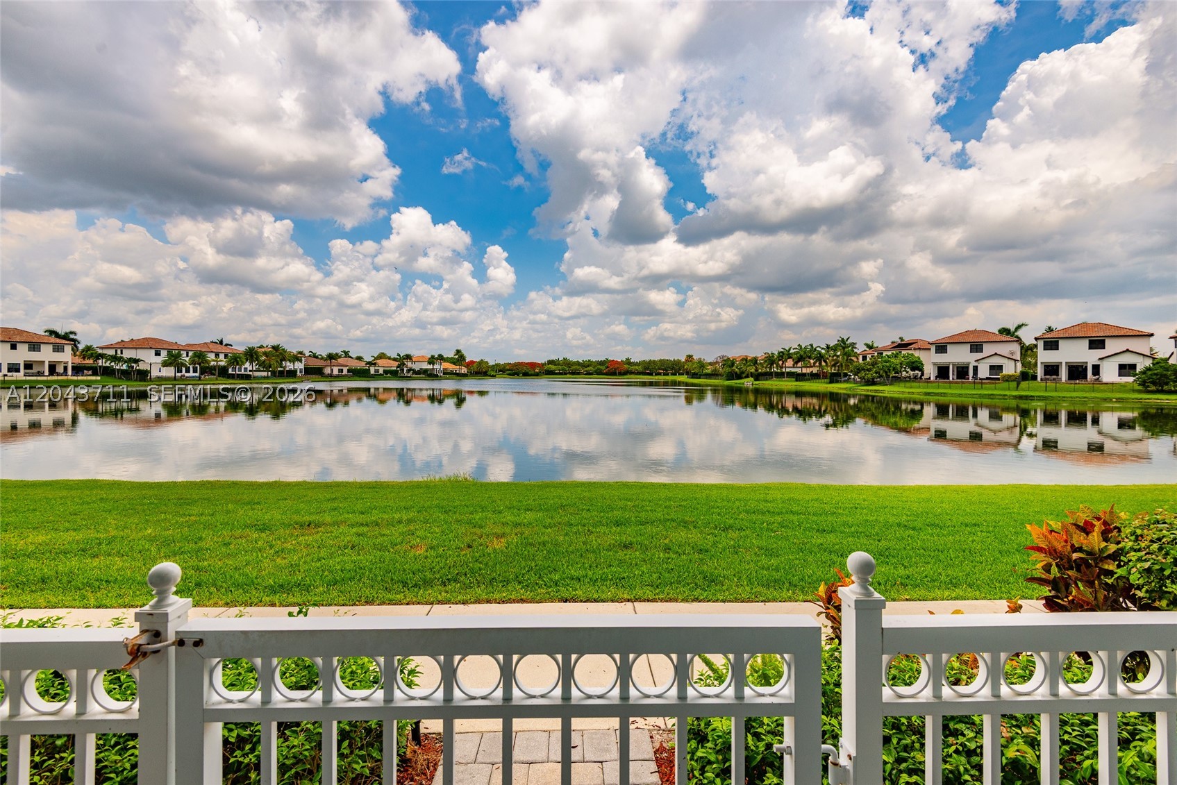 Beautiful waterfront townhouse in the highly desirable Cascada Isles at Monterra in Cooper City, zoned for top-rated schools. Built in 2014, this 3-bedroom, 3-bath home features a bright open-concept layout with high ceilings, abundant natural light, and serene lake views. The kitchen offers granite countertops, ample cabinetry, and a center island overlooking the spacious living and dining areas.

The first floor includes a full bedroom and bathroom, ideal for guests, a home office, or gym. Upstairs, the primary suite overlooks the water, while the additional bedroom provides generous space. Upgrades include engineered wood flooring on the stairs and second level, a custom solid wood and iron staircase, and fresh interior paint.

Enjoy peaceful waterfront living with a private gated front porch, two-car garage, and driveway parking. Ideally located near parks, shopping, dining, major highways, and zoned for top-rated Cooper City schools. Move-in ready and available for immediate occupancy.