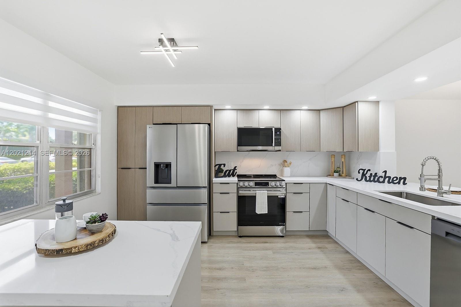 Experience the perfect blend of comfort and modern design in this beautifully updated 2BD/2BA corner unit with serene golf and garden views. The open-concept layout enhances space and natural light, creating a bright and airy feel throughout. NEW!! AC, WATER HEATER, WASHER/DRYER. The new kitchen features ceiling-height custom cabinetry, quartz countertops, a breakfast nook, stainless steel appliances, and LED lighting. Elegant waterproof vinyl flooring flows seamlessly throughout. The oversized primary suite offers a walk-in closet and a remodeled en-suite bathroom with dual sinks. Both bathrooms feature modern finishes. Located in the desirable 55+ Century Village community with 24-hour gated security and resort-style amenities, including a clubhouse,
fitness center, heated pools, tennis courts, theater, and shuttle service. Move-in ready!