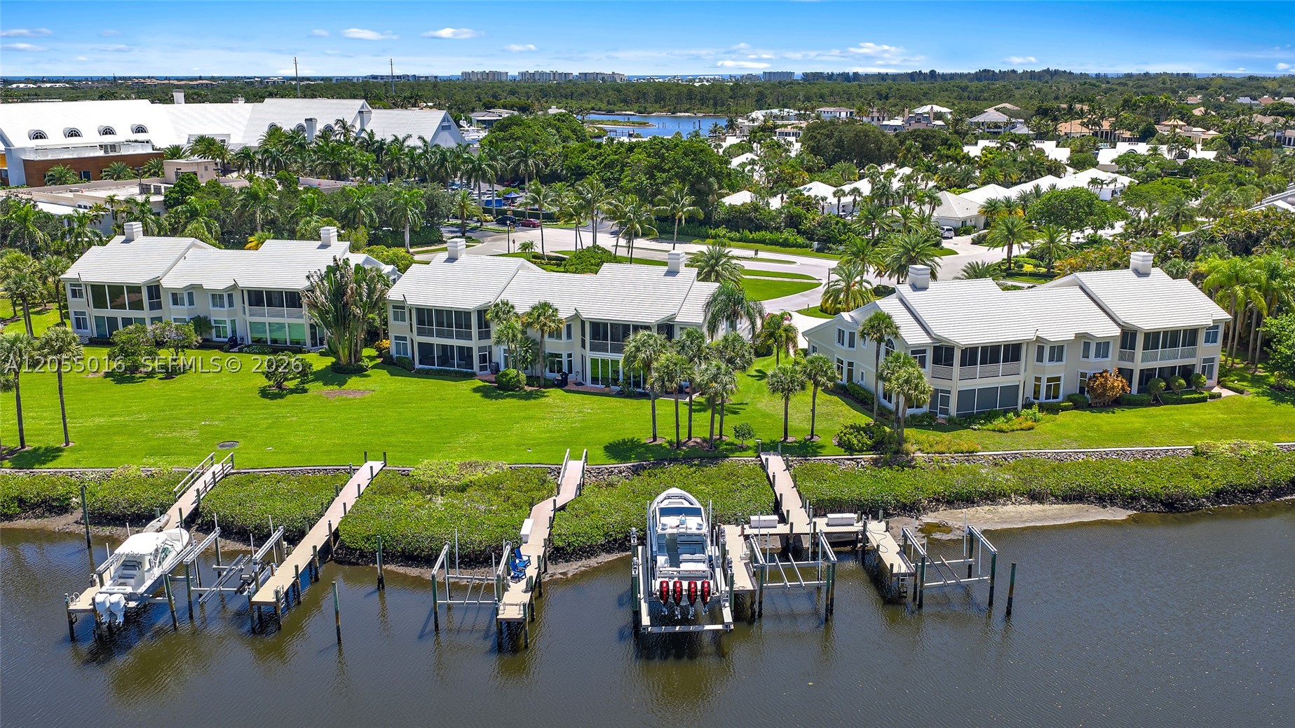 Beautifully updated harbor home in the prestigious Admirals Cove, offering an exceptional waterfront lifestyle just steps from the Club. Ideally positioned with long water views, this residence features a private dock with a 40,000-pound boat lift, providing an ideal setup for boating enthusiasts. Inside, the home has been thoughtfully renovated with a clean, contemporary design featuring a stunning custom kitchen with high-end appliances, spacious open living areas, beautifully updated baths, and an elegant entertaining bar complete with dual wine refrigerators and illuminated floating display shelves—perfect for hosting family and friends. Large walls of glass fill the home with natural light while framing the picturesque waterfront views throughout the main living spaces.

Whether you're heading out on the boat, entertaining guests, or simply enjoying the peaceful water views from the comfort of your home, this residence offers an effortless waterfront lifestyle in one of Admirals Cove's most desirable locations. Located just a short walk or golf cart ride from the Admirals Cove Club, you'll enjoy convenient access to world-class golf, tennis, pickleball, fitness, marina, fine dining, and every amenity that makes Admirals Cove one of South Florida's premier private communities.