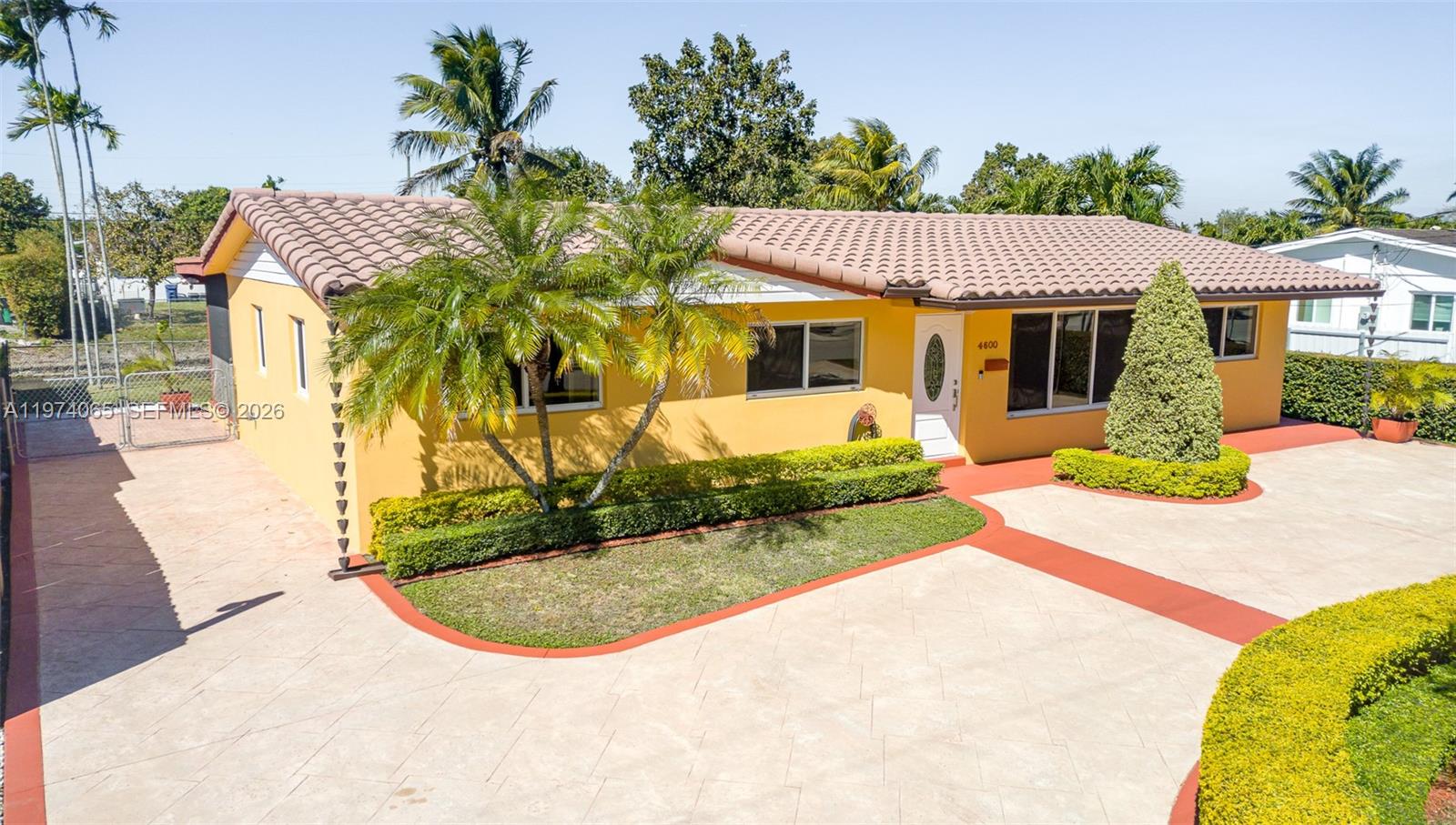Priced to sell fast at $750,000, this one of a kind 4 bed, 2 bath Westchester waterfront home sits on a 75' x 110' lot within the much coveted, flood zone X. The wrap around, stamped concrete, landscaped, circular driveway promotes safety and aesthetics. Additional safety features include hurricane impact windows and doors. Ring flood cameras are located on all four corners of the house and also includes a Ring front doorbell camera.
.
This home seamlessly extends from its majestic 39'x11.5', oversized, screened-in, under roof patio, to 75' of waterfront views. From here you will experience Miami's gorgeous sunsets engulfing the western skies.
 
Bright living area features: Italian marble flooring throughout living room, dining room and kitchen as well as both hallway bathrooms. An abundance of natural light enhances the clean classic look. Both bathrooms also boast, floor to ceiling Italian marble in the shower and tub area. Both marble bathrooms are further enhanced by polished brass Pfister bathroom fixtures.

The remodeled kitchen exudes classic elegance with its matching LG stainless steel refrigerator, electric range, and microwave oven. Soft touch cupboard doors and cabinet drawers along with double lazy Susan's and the built-in 11 bottle wine rack complete the kitchen's elegant look.
