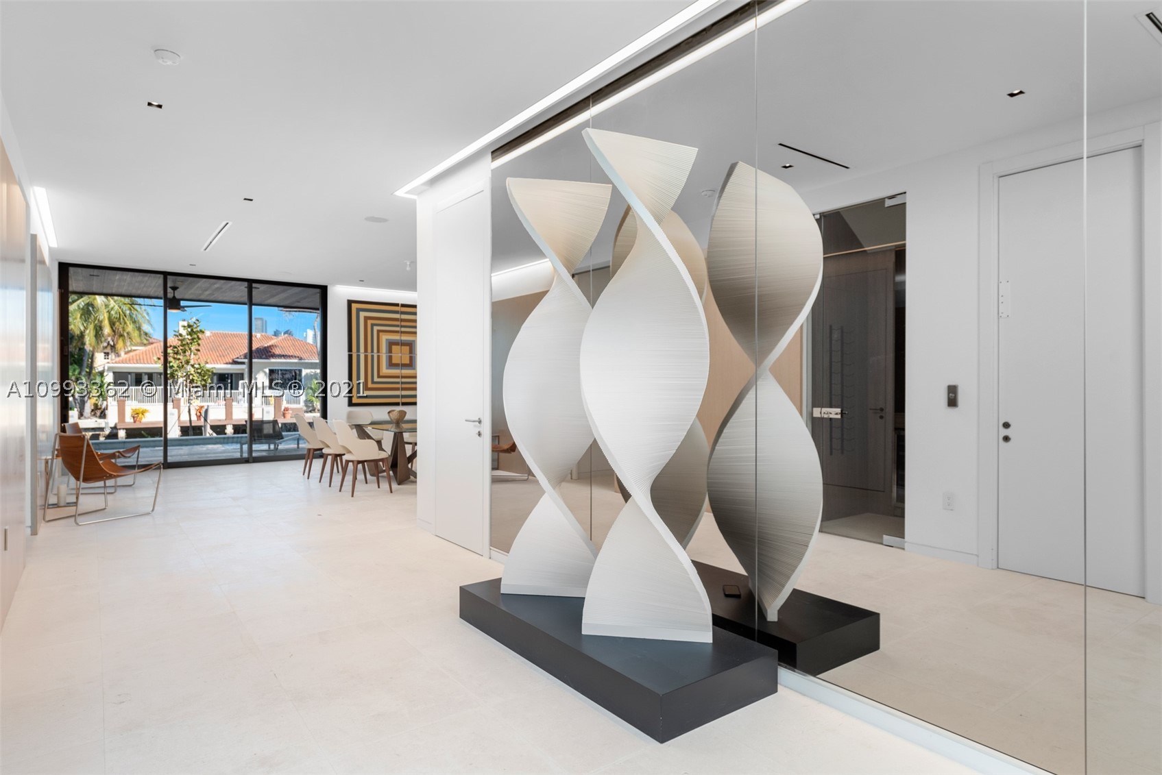 This BRAND NEW one-of-a-kind masterpiece developed by Humberto Ramirez, and designed by Hugo Mijares is the definition of modern luxury living. Boasting 6 bedrooms, 7 1/2 bathrooms, and 5334 sq ft - the home sits upon 80 ft of waterfront with a brand new seawall and concrete dock, offers panoramic & long canal views and a backyard oasis perfect for entertaining. Interior finishes include an Italian kitchen by Minutti, all Miele appliances, electric blinds, security and smart system throughout and a beautiful waterfall feature into the pool to name a few.