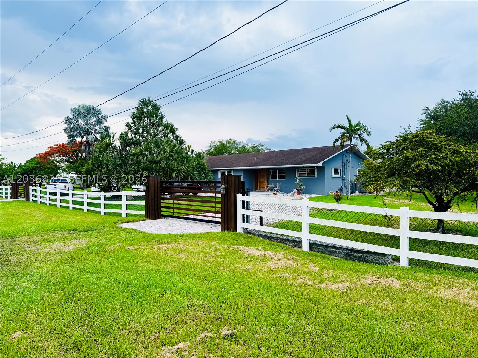 Welcome to your private Redlands retreat! Situated on 3.31 acres, this beautifully remodeled 3-bedroom, 2-bathroom home offers the perfect blend of comfort, space, and country living. The property features a sparkling swimming pool, a 6-stall horse stable ideal for equestrian enthusiasts, and a variety of mature fruit trees that enhance the beauty and functionality of the land. Located on a desirable corner lot, this fully fenced estate offers exceptional privacy, security, and endless opportunities for outdoor living. With plenty of room for horses, agricultural use, recreational vehicles, or future expansion, this property is truly one of a kind. Enjoy the peaceful lifestyle of the Redlands while remaining conveniently close to shopping, dining, schools, and major roadways. A rare opportunity to own a turnkey acreage estate in one of South Florida's most desirable rural communities.