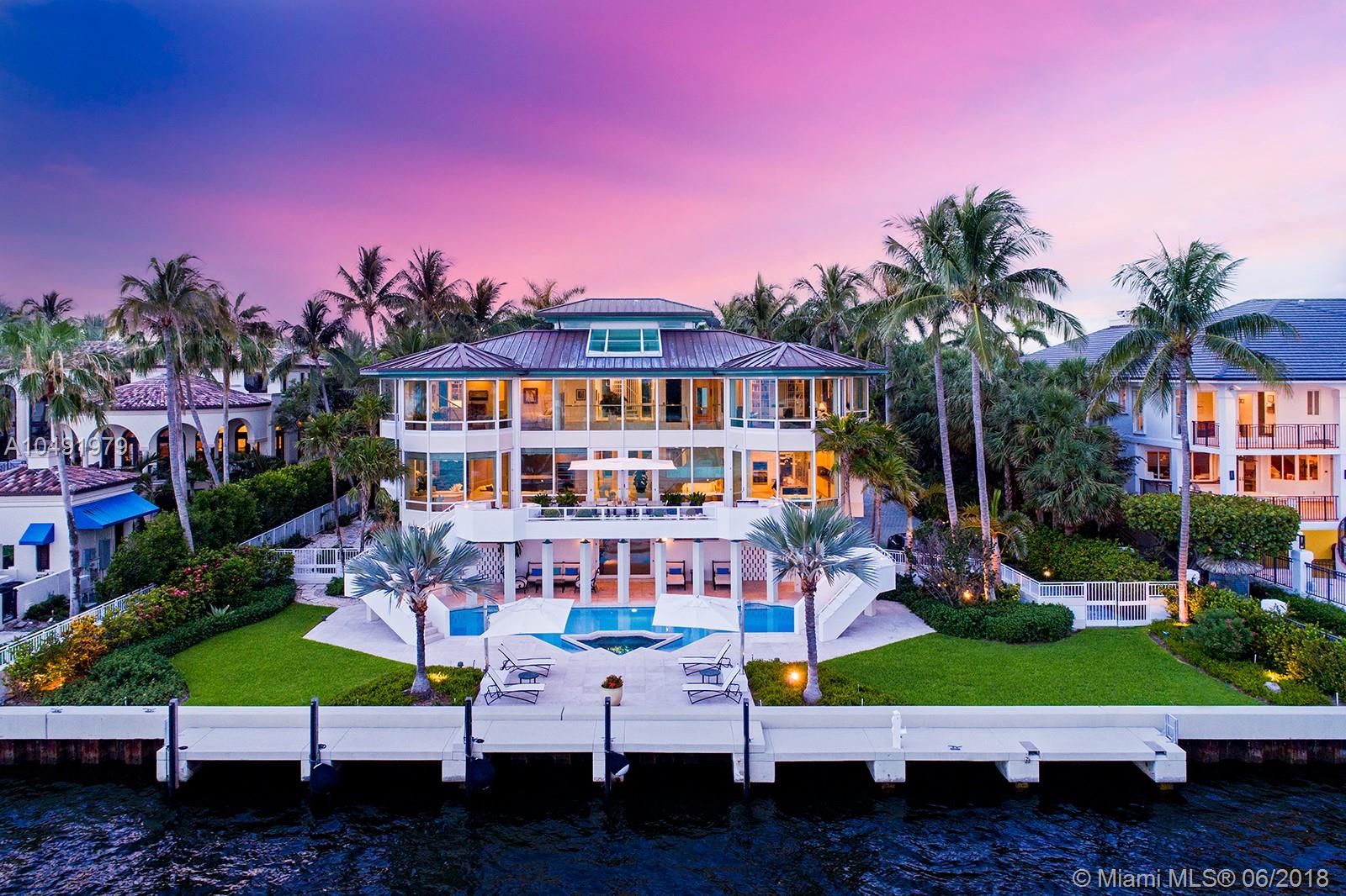 Nestled in one of the most exclusive gated communities - Tahiti Beach, this impressive home sits on nearly 1 acre featuring 121 feet of water frontage. Drive directly into paradise with a massive welcoming front yard. The home boasts 6 bedrooms and 7.5 bathrooms of which are all ensuite. Picturesque views from every bedroom overlooking the bay and downtown Miami skyline, the best views in Miami. This Tahiti Beach residence offers luxurious floor to ceiling windows with an abundance of natural lighting throughout. Grand backyard paradise complete with a sparkling pool and spacious lounge area. Boaters dream mansion with direct access to Biscayne Bay.