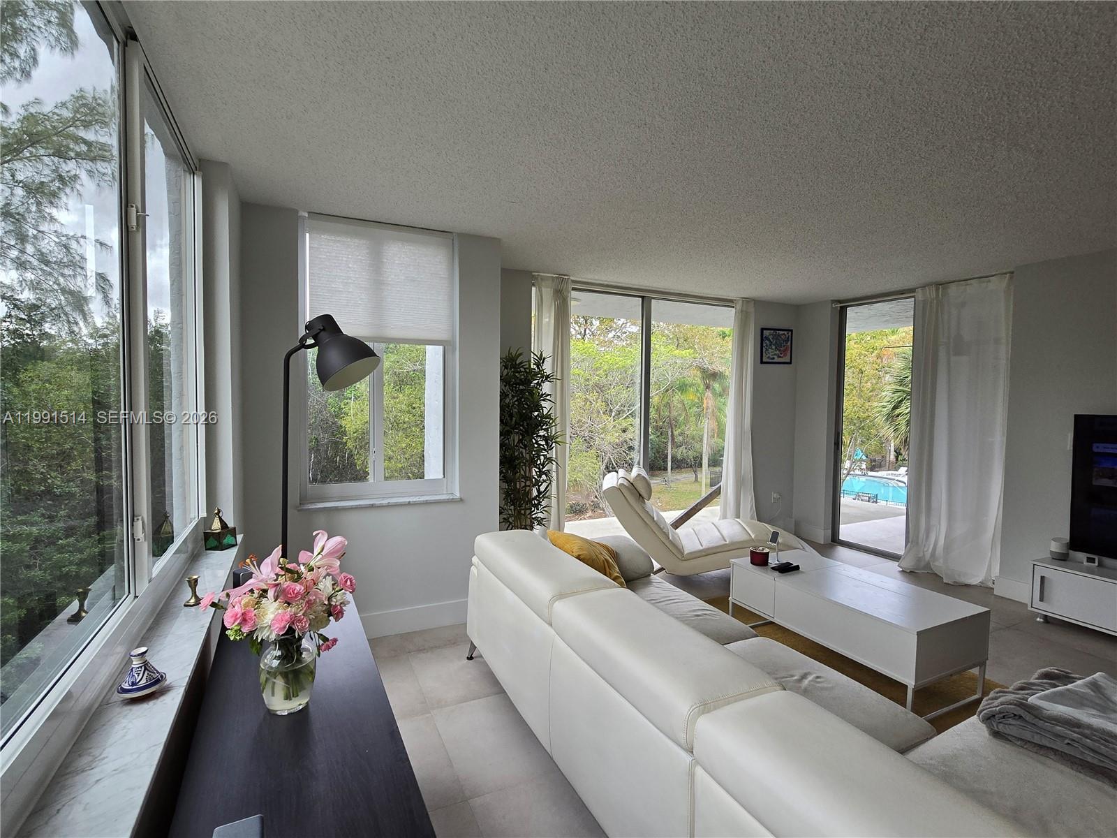 Welcome! It is a pleasure to present to you this elegant, bright 1652 sq ft 3/2 condo in Greynolds Park Club, offering one of the most stunning views in the building with trees, pool and open sky as your backdrop. FEAUTURES: Updated corner unit plenty of windows and light. Beautiful and contemporary floor; new impact windows. Large kitchen overlooking nature, stainless steel appliances, custom-made cabinets. Big master bedroom with two walking closets and bathroom. Plenty of closets and laundry room(hook up). Oversized balcony. Two parking spaces.  BUILDING UPDATES: The building has undergone significant updates, including a new roof(finished) and impact windows, concrete and restoration with additional renovations in progress to further enhance the community. COMMUNITY: Gym, pool, Club house, green backyard, BBQ area, detached garage, gated entry. HOA: it requires minimum credit score of 700 for buyers and a maximum occupancy of 5 persons per this unit. Pets until 20 pounds. Rent after 1 year owned. It has reserves.  HIGHLIGHTS: Sharing Greynolds Village: Neverland Cafe, art gallery, bar, hair salon. PRIME LOCATION!!!. Its prime location places you just 8 minutes from Sunny Isles Beach, and 5 minutes from Aventura Mall, access to I-95, the Turnpike, and the 826 expressways. Nearby of FIU, Barry University, Miami Dade College, Aventura Hospital, Jackson North Hospital, Fort Lauderdale Airport, and a wide variety of restaurants and services. 
Seller motivated. Easy to showing