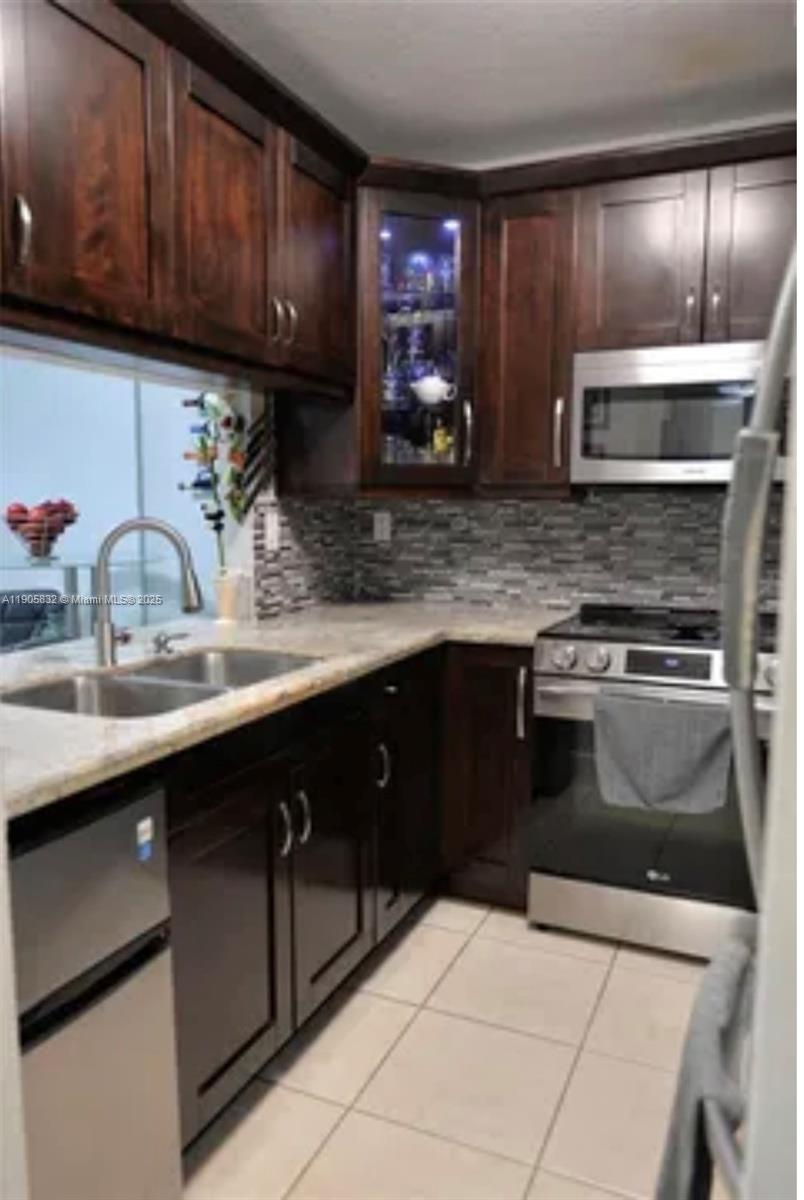 Step into this beautifully remodeled and move-in ready condo offering the perfect blend of comfort and style. Featuring a spacious layout w/natural light, this 1bed/1bath unit boasts elegant tile flooring throughout and a private balcony for your enjoyment. The kitchen is equipped w/SS appliances/Add'll mini fridge, complemented by modern finishes and ample cabinet space. Enjoy the convenience of an in-unit W/D plus a common laundry room on every floor. The bedroom includes a walk-in closet. Upgrades include a 2020 A/C system and a 2020 tankless water heater. The community pool, and the unit comes with one assigned parking space along with plenty of guest parking. Centrally located in the sought-after Kendall area, near top-rated schools,shopping,dining, easy access to major expressways.