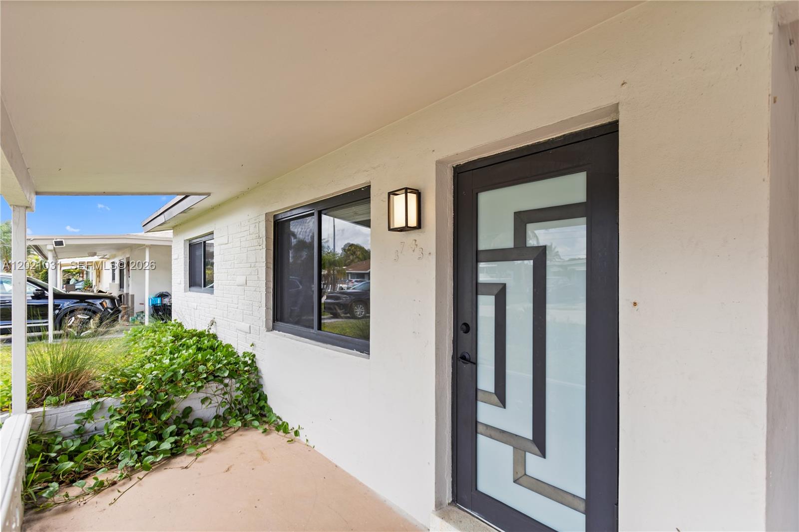 Beautifully updated 3-bedroom, 2-bathroom single-family home featuring impact windows and doors throughout. This move-in ready property offers a remodeled kitchen with elegant quartzite countertops, renovated bathrooms, and updated flooring throughout the home. Conveniently located near Federal Highway, Sample Road, schools, hospitals, shopping, dining, and major commuter routes.