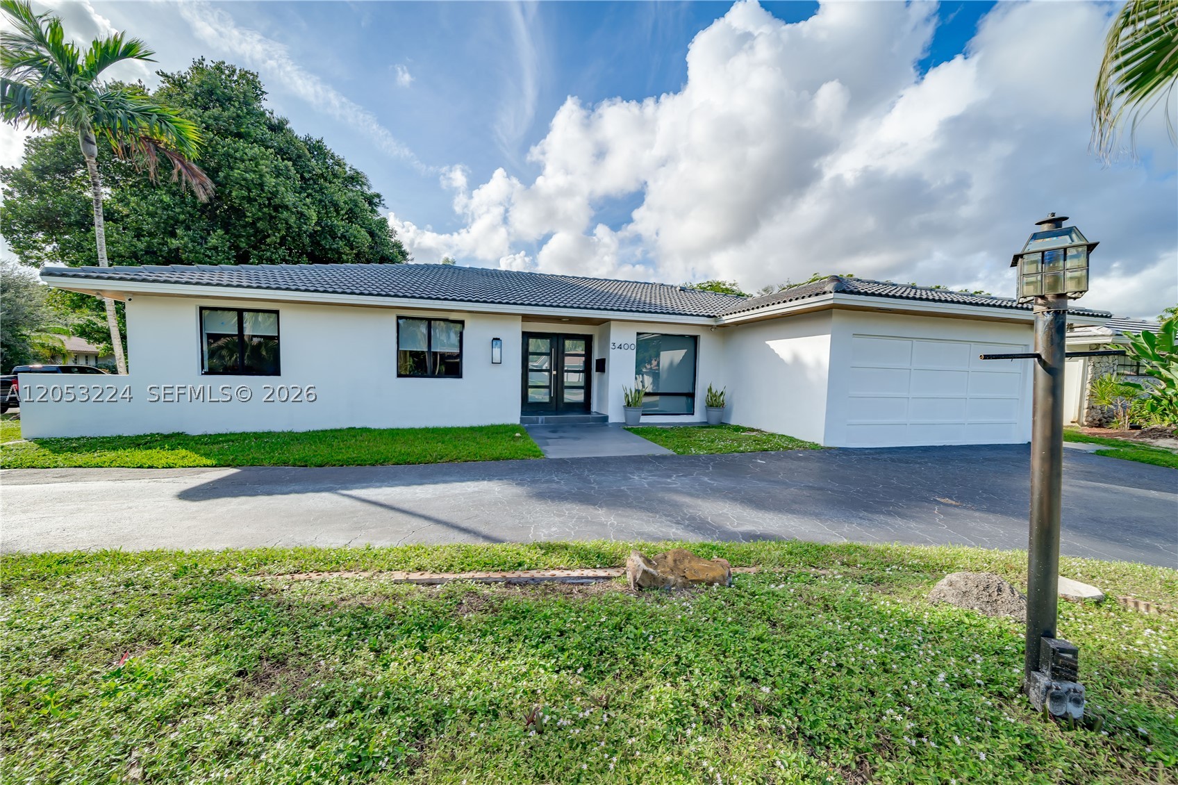 BEAUTIFUL NEWLY RENVATED RANCH HOME IN HOLLYWOOD! TASTEFULLY DESIGNED WITH PORCELAINE TILES THROUGHOUT, LARGE MODERN KITCHEN, TWO OVENS, TWO SINKS, WI-FI REFRIGERATOR AND A HUGE ISLAND FOR CASUAL DINNING. ENJOY LARGE OPEN FLOOR PLAN WITH LOTS OF LIGHT, FEATURING FAMILY ROOM AND FORMAL DINNING AREA. 5 BEDS / 4 FULL BATHS DONE AT THE HIGHEST LEVEL. RENOVATED POOL AND JACUZZI, NEW POOL DECK FOR A GREAT OUTDOOR EXPERIENCE. HURRICANE IMPACT WINDOWS AND DOORS. CLOSE TO TY PARK, CLOSE TO SHOPS AND RESTAURANTS. A MUST SEE!