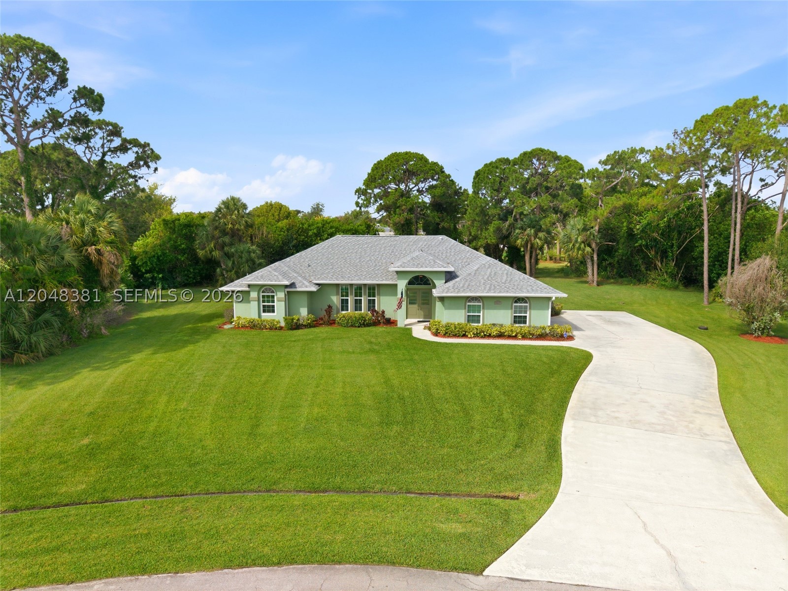 Nestled on an oversized 0.55-acre homesite in the desirable Sandpiper Bay Non-HOA area, this beautifully maintained 3-bedroom, 2.5-bath pool home offers the perfect combination of PRIVACY, SPACE, & FLORIDA LIVING. Ideally located on a quiet street surrounded by mature trees & an expansive yard = PRIVACY. Through the double-door entrance one is greeted by vaulted ceilings, both formal & informal living rooms, a bright kitchen overlooking the pool, a separate cabana half-bath, & an ideal split bedroom design. Primary suite offers direct access to the pool & a large ensuite bath with both his & her walk-in closets = SPACE. Exterior offers a long 100ft+ driveway & 2-car garage, one can easily house numerous toys (boats, RV, motorcycles, etc.) Screened in HEATED POOL with spa & plenty of patio space for entertaining or relaxing = FLORIDA LIVING. Some HIGHLIGHT FEATURES include a NEW 2022 ROOF, UPDATED IMPACT WINDOWS, ACCORDION SHUTTERS FOR PATIO, FULL HOUSE GENERATOR, UNDERGROUND PROPANE TANK, NEW WATER HEATER, NEW POOL HEATER, & CITY SEWER. Don't wait to make this home your own!