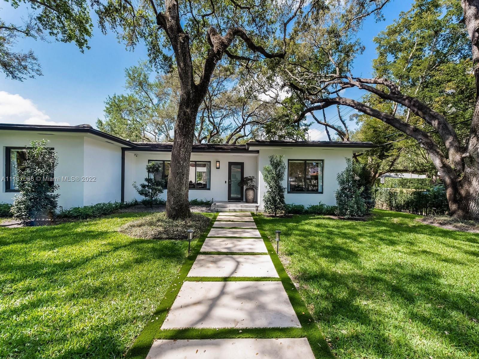 Welcome home to this completely remodeled designer 3 bedrooms plus 1 convertible room, corner lot house. Featuring open spaces full of natural light, volume ceilings & an open floor plan. Oversized living/family room overlooking the beautiful backyard & pool. Generous size bedrooms with engineer wood floors throughout. MIA-Cucina Italian Kitchen with Subzero, Bosch and top-of-the-line appliances. Fresh outdoor dinning & BBQ area under one of the many Oak trees this house owns. Walk out to the patio to an amazing pool that includes a waterfall and jacuzzi. This home features impact windows, doors & new AC systems. Smart home with Savant system,  audio/video and alarm integrated. Walking distance to Biltmore Hotel and St Theresa School! Must see!
