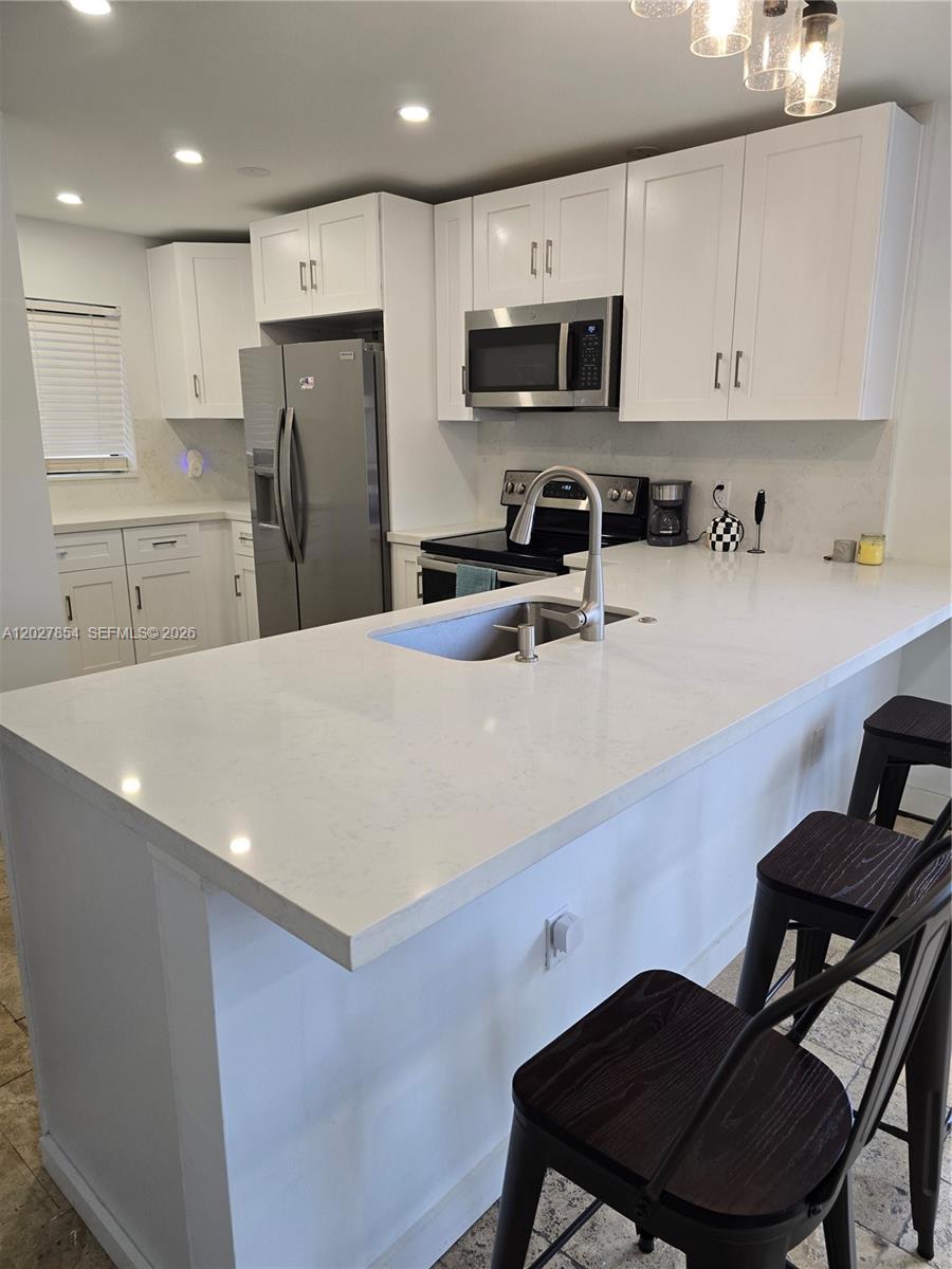 Gem of apt with 2 bed/2 bath, courtyard condo open space concept in the heart of Hollywood, CORNER UNIT with large windows to enjoy abundant natural light thru the day, creating a bright and warm atmosphere. Kitchen features New: SS appliances, white cabinets and quartz counter top, NEW bathrooms. Master suite boasts
walk-in closet and private bath. You can enjoy your morning coffee on your full size balcony providing outdoor
living space. Amenities include pool, BBQ area w/large open yard & laundry on site. Centrally located close to
shopping, transportation, restaurants, clubs, beaches, I-95, Downtowns, Hard Rock Hotel and Casino, Airports, and more. Hurry to see this one, won't last!!!