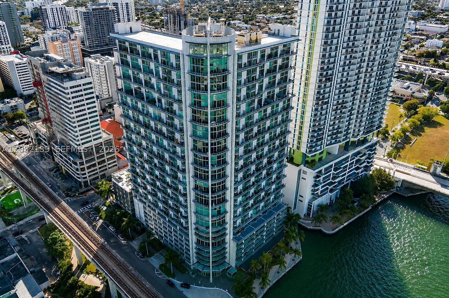 Stylish loft-style residence in the sought-after Neo Vertika! This modern unit features soaring concrete ceilings, an open floor plan, floor-to-ceiling impact windows, and a private balcony with stunning city and Miami River views. The contemporary kitchen offers granite countertops, stainless steel appliances, and ample cabinet space. Enjoy the convenience of an in-unit washer and dryer, spacious living areas, and abundant natural light. Neo Vertika offers exceptional amenities including a waterfront pool, state-of-the-art fitness center, clubroom, business center, 24-hour concierge, valet, and covered parking. Prime Downtown Miami location, just steps from Brickell City Centre, Brickell financial district dining, shopping, entertainment, and major highways. Experience the best of urban living in this unique loft-style home.