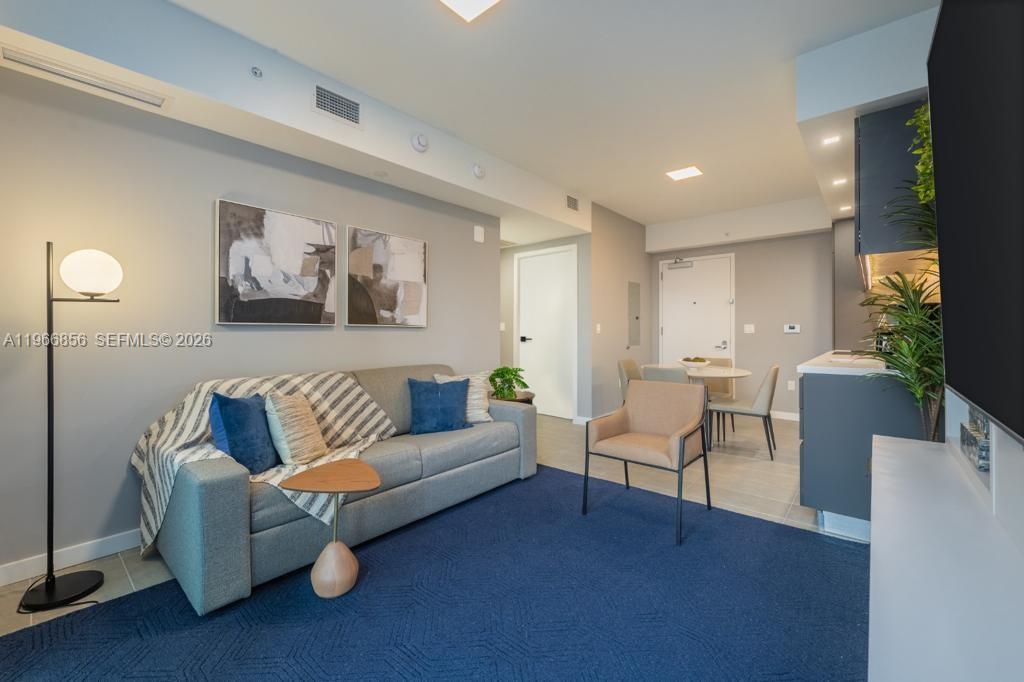 Experience the ultimate blend of lifestyle and investment at YOTELPAD Miami, ideally located in the heart of Downtown. This modern 1-bedroom, 1-bath residence offers sleek finishes, smart design, and a functional layout that comfortably accommodates up to four guests. The unit features a fully equipped kitchen with washer and dryer in-unit, balcony, and contemporary furnishings designed for both comfort and style. Large windows invite natural light, enhancing the clean and sophisticated ambiance. Enjoy world-class amenities including a rooftop resort-style pool, spa, 24-hour fitness center, residents lounge, and on-site dining. Just steps from Bayside Marketplace, Kaseya Center, PortMiami, Brickell, Metromover, top restaurants, and entertainment. A rare opportunity offering exceptional rental flexibility, prime location, and turnkey convenience — ideal for investors seeking strong short-term rental potential or buyers looking for a modern Miami retreat.