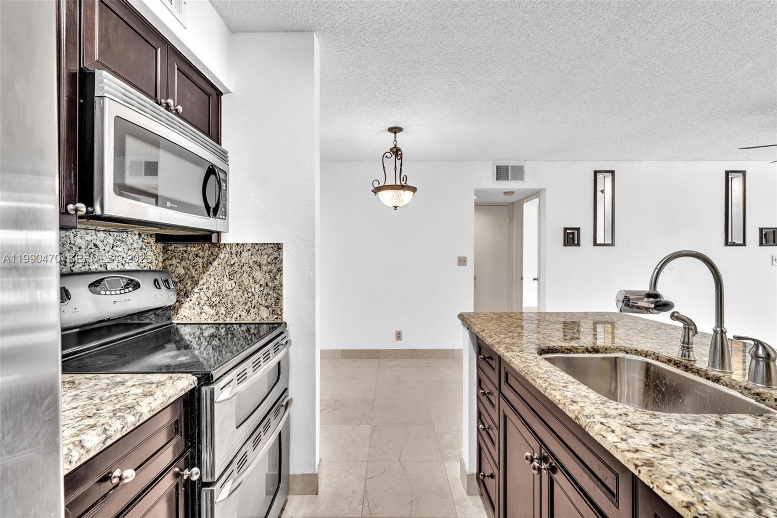Location, location, location! Justa few minutes from Nova Southeastern University, this beautifully updated 1bedroom, 1bath residence offers serene garden and canal views. The unit features an open concept kitchen with bar top seating, granite countertops, and elegant marble flooring throughout, complemented by a dedicated dining area, walk in closet, and in unit laundry for ultimate convenience.

Enjoy a well maintained, pet-friendly community with resort style amenities including a pool, BBQ area, private gym, and tennis courts. Ample parking available. Centrally located near Nova University Medical Center, Whole Foods, major banks, and premier shopping and dining.

Excellent investment opportunity or perfect place to call home don’t miss it.