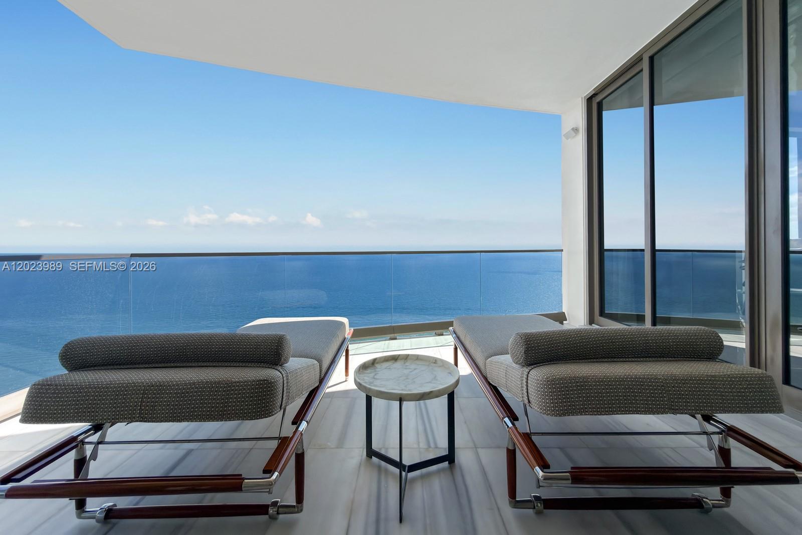 Ascend to a new level of luxury w/ this one-of-a-kind Bugatti Residence in the Sky. Perched high above the coastline, this 4,450-square-foot masterpiece captures sweeping, cinematic views—sunrise over the Atlantic to the east, & golden sunsets over the city skyline to the west. World-renowned interior designer Ricardo Britto curated each space with intentionality, layering exquisite textures, Ettore Bugatti’s signature Bleu flows elegantly throughout the 4 bedrooms and 5 bathrooms residence. In the dining area, history and innovation converge as automotive-grade carbon fiber reimagines Carlo Bugatti’s iconic 1902 Cobra Chair. In the great room, Italian-crafted furnishings, & masterful architectural details. This isn’t simply a home—it’s a collector’s dream. A trophy in the sky.