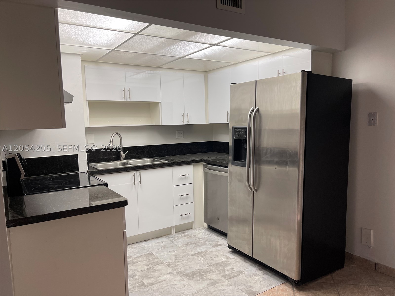 Great 1/1 on first floor. Updated kitchen, new bathroom, new bedroom laminated floor, just painted. Washer/dryer in the unit. Very convenient parking spot on the side of the unit. Community pool.