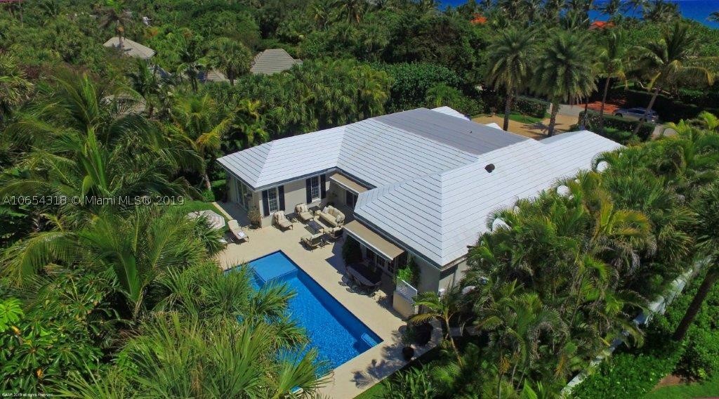 This very special 4-bedroom, 4-bath Bermuda style home is in an ideal Island central location!  The impeccably maintained house features CBS construction, beautiful hardwood floors and offers 3,064± square feet of comfortably sophisticated living areas.  Recent improvements include impact glass windows, new shutters, new garage door, indoor & outdoor lighting and a fresh coat of paint. The outdoor entertainment areas have been fully upgraded with a refurbished heated pool and patio area including motorized awnings to complete the picture.  This attractive house is light and bright and close to Island amenities…making it the perfect place to hang your hat!