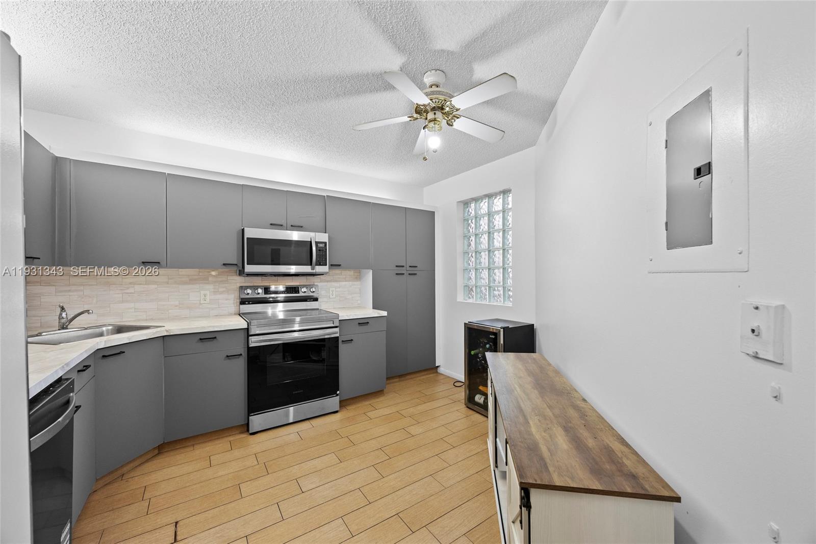This open layout home offers a split floor plan with the primary suite featuring a walk-in closet and full bath separate from the other 2 bedrooms and bath. The central living area includes the eat in kitchen, modern dining space, and bright and modern living room that opens to a private screened balcony. You also have your own of in-unit washer/dryer. Enjoy the serene lake views on the walking trail. Perfectly located near dining, shopping, movie theater, casino, and with easy access to Sawgrass Expressway, Turnpike, & I-95 Expressway