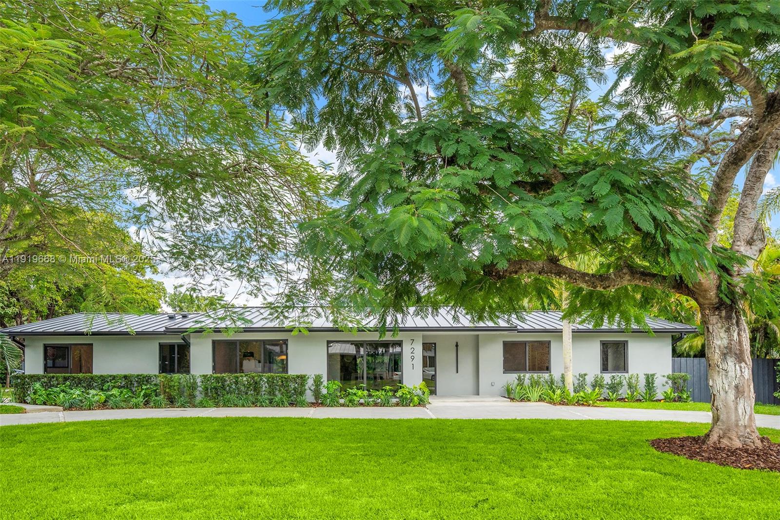 High end finished and just completed this fully remodeled Pinecrest residence offers 2,791 SF under A/C on a 17,337 SF lot, featuring a split floor plan with 4 bedrooms and 3.5 bathrooms. Every detail is brand new — roof with 10-year warranty, electrical, plumbing, insulation, impact windows, modern bathrooms, and a designer kitchen with premium appliances. Open living and dining areas flow seamlessly to a wide covered terrace, ideal for indoor–outdoor living. The luxury primary suite includes a spacious custom walk-in closet, a sleek spa-style bathroom, and serene garden views. With lush new landscaping, irrigation system, and top-rated Palmetto schools just steps away, this move-in-ready, newly completed home is a rare Pinecrest opportunity. Ready to move in.