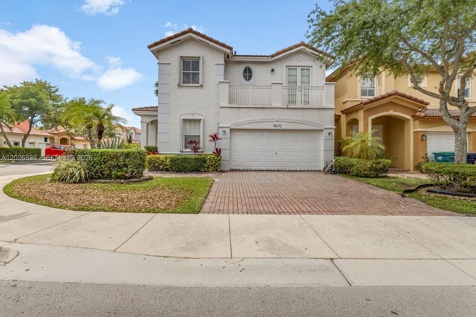 Discover this stunning 5-bedroom, 3-bathroom home located in the prestigious Islands at Doral community inside Madeira II. Situated on a desirable oversized corner lot in a quiet, family-oriented neighborhood surrounded by top-rated schools, this impeccably maintained residence perfectly blends elegance, comfort, and convenience. Lovingly owner-occupied and exceptionally cared for, the home features a remodeled contemporary kitchen, spacious open living areas, and an ideal layout designed for both everyday living and entertaining. One full bedroom and bathroom are conveniently located downstairs, offering flexibility for guests, in-laws, or a home office. Enjoy the comfort and privacy of a large patio, perfect for entertaining, outdoor dining, or simply relaxing with family and friends. The oversized corner-unit location provides added space, privacy, and natural light throughout the property. Residents enjoy access to a spectacular resort-style clubhouse featuring a sparkling pool, tennis and basketball courts, playground, and charming lakeside tiki huts. This exceptional home offers the perfect combination of luxury, security, comfort, and lifestyle — truly waiting for its next owner to call it home. A rare opportunity to experience the very best of Doral living.