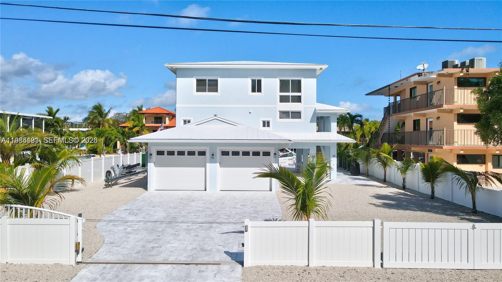 Welcome to a stunning, fully remodeled coastal retreat in the highly sought-after Ocean Isle Estates. This exceptional 4-bedroom, 4-bathroom residence offers over 3,000 square feet of living space and showcases breathtaking open water views from multiple vantage points.

Designed for both relaxation and entertaining, the home features two spacious master suites, a beautifully updated interior, and a separate lower-level 1-bedroom/1-bath suite complete with a recreation area—perfect for guests or extended family.

Step outside to your private waterfront oasis, where a pool sits right at the water’s edge, complemented by a 17,000 lb boat lift—ideal for boating enthusiasts looking for direct ocean access. The property also boasts a rare two-car garage along with ample additional parking, a durable metal roof, and impact windows and doors for peace of mind.

Situated on an 8,400 sq ft lot in one of Key Largo’s premier neighborhoods, this home combines modern upgrades with the laid-back luxury of the Florida Keys lifestyle.