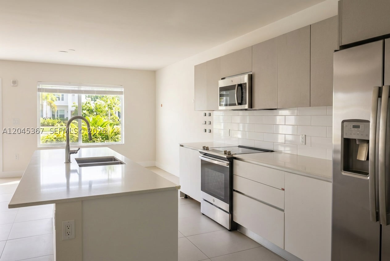 Beautiful 3-bedroom, 2.5-bath residence located in the desirable gated community of Aventura Village. This bright and well-maintained unit features an open living area, modern kitchen with stainless steel appliances, contemporary cabinetry, and a functional layout designed for comfortable everyday living.
The property offers a private rear patio with direct access to a green common area, creating additional outdoor space and privacy. Freshly updated and move-in ready, this home is ideal for end-users or investors looking for a well-located property in a high-demand area.
Community amenities include a swimming pool, gated access, landscaped common areas, and one assigned parking space. Conveniently located near Aventura Mall, shopping centers, restaurants, major highways, Gulfstream Park, Sunny Isles, and with easy access to both Miami and Fort Lauderdale.
Excellent opportunity to own in a centrally located Aventura-area community with strong rental demand and long-term investment potential.