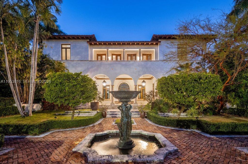 Spectacular in scale and unrivaled in waterfront presence, Villa De Casuarina is a Mediterranean-inspired estate set within the prestigious, guard-gated enclave of Gables Estates. Encompassing over 11,500 square feet on an expansive 34,876 square-foot lot, this private Riviera-style retreat offers 8 bedrooms, 8 bathrooms, and 2 half bathrooms, commanding an extraordinary 388 feet of water frontage, a rarity within one of South Florida’s most exclusive communities.

A grand foyer with soaring ceilings and Italian tile flooring establishes a tone of timeless elegance, unfolding into formal and informal living spaces designed for elevated entertaining. Interior highlights include a wine cellar, cigar room, private theater, and disco lounge, offering a residence equally suited for intimate moments and large-scale gatherings. The recently renovated chef’s kitchen anchors the home with marble countertops, dual Sub-Zero refrigeration, Miele coffee stations, and premium appliances, blending refined design with everyday functionality.

Outdoors, manicured gardens frame a resort-style setting with a heated pool, expansive terraces, and private dockage accommodating up to a 80-foot yacht. Ideal north exposure fills the home with soft natural light, complemented by impact windows throughout. Villa De Casuarina stands as a rare waterfront compound where scale, privacy, and enduring elegance converge in one of Coral Gables’ most tightly held enclaves.