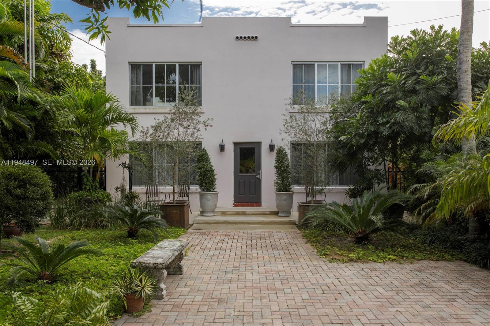 This beautiful, unique four-unit building is located in the heart of the historic Shenandoah area of Miami. The property is recessed on a lush, landscaped lot featuring dozens of tropical and native trees, several beautifully potted plants, which include 2 olive trees and a magnificent mango tree, enhancing the property’s ‘private oasis’ vibe. Various outdoor seating areas offer quiet, secluded relaxation. A Rain Bird irrigation system was installed to maintain the landscaping. Also, pre-wiring was done for low-voltage landscape lighting. The property has an entry electric gate and secure parking on the premises. Each unit has been updated with brand-new hurricane impact windows, window treatments, split A/C units, and updated kitchen and bathroom cabinets. Large windows provide significant natural light throughout each room, allowing nature in. The location is ideally situated minutes away from Key Biscayne, Brickell, downtown, Wynwood, Coral Gables, and Coconut Grove. Easy access to the airport, main highways, stadiums, and Miami Arena.