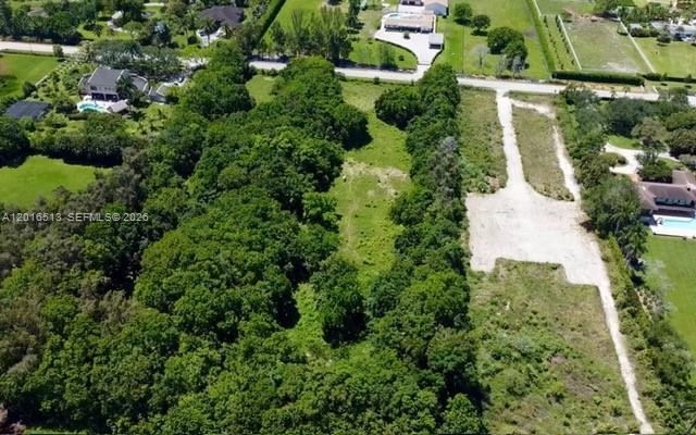 Rare 4.70-acre development opportunity in the highly sought-after Sunshine Ranches community of Southwest Ranches. Per the Broward County Environmental Permitting Division, the property contains no wetlands, significantly streamlining the path for future development. With ample usable acreage and no HOA restrictions, this site offers exceptional flexibility for builders, developers, and investors seeking to create a luxury residential estate, private compound, or boutique equestrian enclave.
Located in one of South Florida’s premier acreage communities, the property is surrounded by multimillion-dollar estates and attracts professional athletes, entertainers, and executives seeking privacy and space while remaining close to major highways, upscale shopping, dining, and business hubs. The area is also served by top-rated schools, enhancing long-term residential demand and resale potential. Nearby farmers markets and an established luxury-rural lifestyle further elevate the appeal of this unique development parcel.