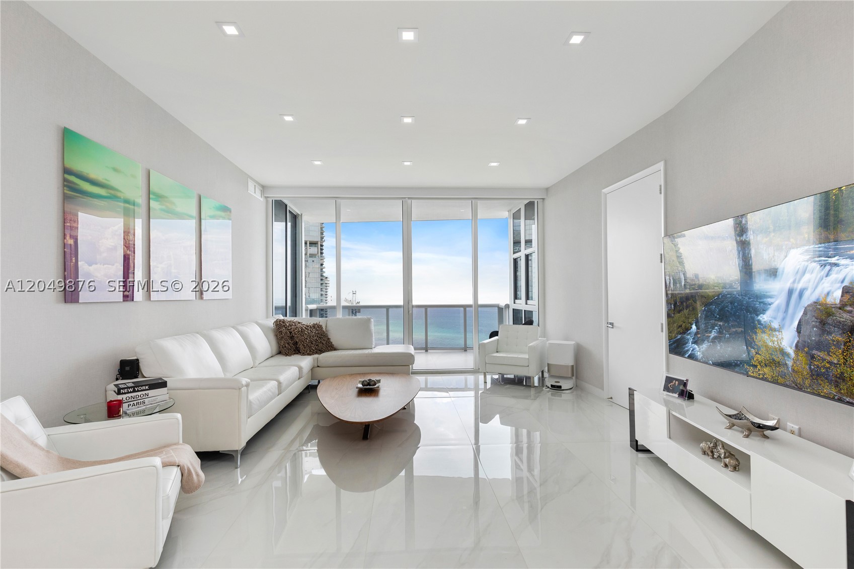 Beautifully updated oceanfront residence at Trump Royale in Sunny Isles Beach. From the main living area, kitchen, balcony, and bedrooms, the views are truly amazing. This condo has a clean modern feel with glossy floors, floor-to-ceiling glass, designer finishes and lighting, and soft neutral colors.

The open kitchen features a large island, sleek cabinetry, built-in appliances, and generous space for cooking and entertaining. The living and dining areas connect naturally to the balcony, creating an easy indoor-outdoor flow.

The primary suite offers direct water views, good closet space, and a spacious bath with double sinks, soaking tub, and separate shower. Additional bedrooms are private and comfortable for family or guests.

Trump Royale offers beach service, pool, spa, fitness center, tennis, valet, concierge, and a prime Collins Avenue location in Sunny Isles. You're close to Aventura, Bal Harbour, restaurants, shopping, and both Miami and Fort Lauderdale airports.