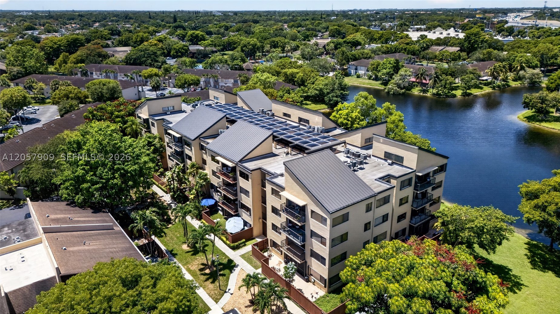 Spacious 2-bedroom, 2-bathroom condominium offering over 1,300 square feet of well-designed interior space. The desirable split-bedroom layout provides added privacy, while generous closet space ensures plenty of storage throughout. Enjoy your morning coffee or unwind in the evening on the oversized private balcony. This move-in-ready home features tile flooring throughout, an in-unit washer and dryer, elevator access for added convenience, and an extra private storage nearby. Located in a well-maintained, gated community with a secure guard-gated entrance and building access, residents enjoy peace of mind along with excellent amenities. Monthly maintenance includes cable TV, high-speed internet, water, and insurance, making for easy, worry-free living. Conveniently located near shopping, dining, and major roadways, this is an exceptional opportunity to own a spacious home in a desirable community.