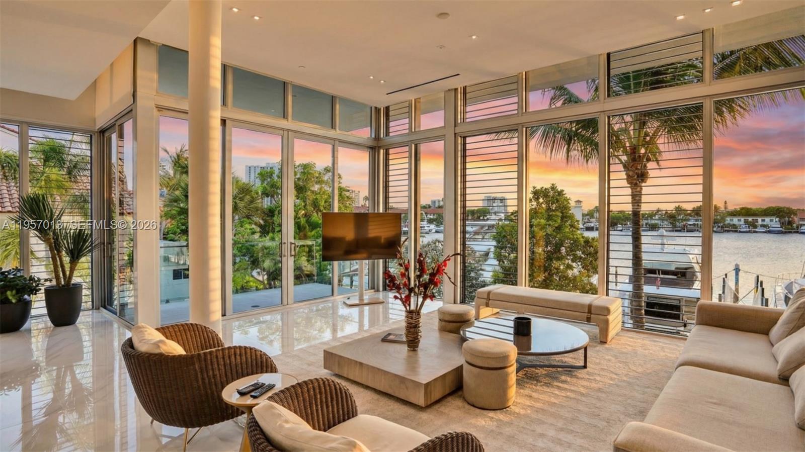 An exceptional waterfront residence in VIDA at The Point, an ultra-private enclave of just six designer townhomes set directly on the Waterways Marina. Completed in 2022, this expansive 4-bedroom, 4.5-bath home spans nearly 3,800 square feet and delivers a rare blend of architectural sophistication, privacy, and resort living.

Designed by Interiors by Steven G. and furnished with Artefacto, the interiors showcase soaring ceilings, refined finishes, and a seamless indoor-outdoor flow. The open-concept layout features a private elevator, European Mia Cucina kitchen with Wolf and Sub-Zero appliances, ensuite bedrooms, and sunset-facing terraces overlooking the marina.

Residents enjoy access to 35+ gated acres of The Point’s world-class amenities, including a full-service spa, fitness center, tennis and basketball courts, multiple pools, café, and concierge services. A private garage and carport are included, with a 90-foot boat slip available for purchase, offering direct ocean access with no fixed bridges.

Quietly luxurious yet moments from the Waterways Shops, dining, and all that Aventura has to offer — this is waterfront living at its most refined.