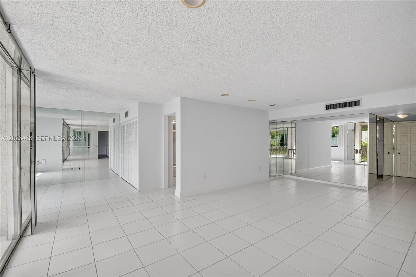 Priced to sell quick! Discover this charming first-floor all ages condo at 4230 D'este Ct. Unit 107, boasting over 1,150 sq. ft.  in coveted Palm Beach County. This well-maintained unit offers full impact protection and was creatively converted from 3Bedroom to 2Bedroom, and can easily be converted back with minimal modifications. Enjoy freshly painted interiors, newer appliances, new electrical panel,  ample storage, and a cozy covered patio. Convenient laundry with washer/dryer hookups and an all-in-one washer/dryer unit included. Unit just steps from the community pool, and surrounded by championship golf courses, pristine beaches, and vibrant shopping malls. Residents can also have the option to join the country club for access to expanded amenities and recreational facilities. Minutes to Palm Beach Airport and major highways. This is a Secure Gated community with 24/7 security & mobile patrol for added peace of mind.  Great investment to renovate to your personal taste! This is a great opportunity for buyers seeking value, location, and amenities. Schedule your showing today before this opportunity is gone.