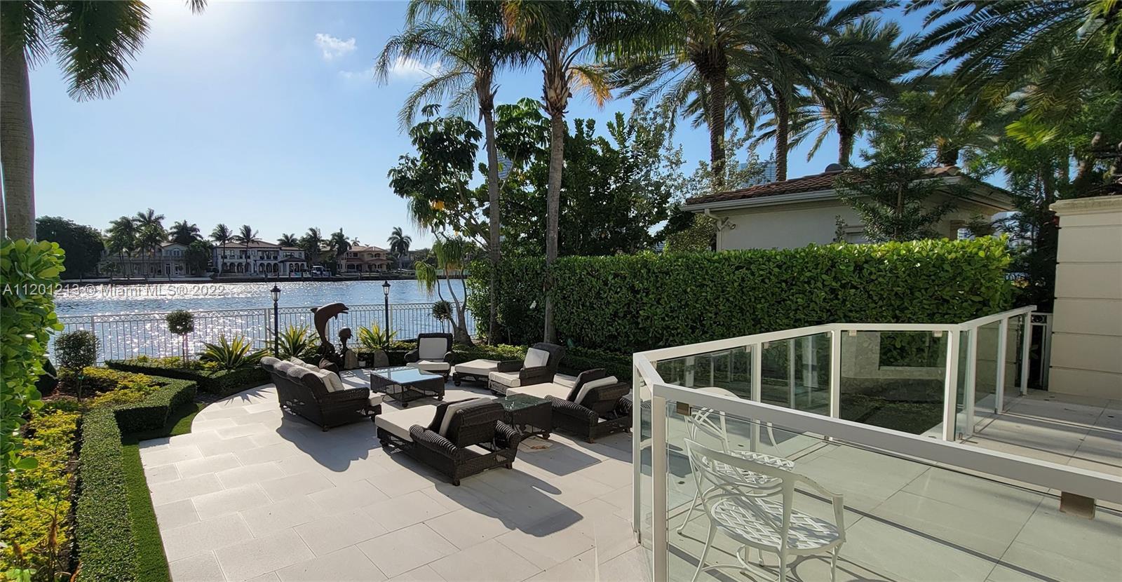 PORTO VITA - NEWLY REMODELED by Jeff Howard Design Group, this contemporary styled 2 story, 3 Bedroom + Office +Den and 4 and 1/2 baths corner waterfront Townhouse is chic and refined. Impeccable neutral palette featuring italian porcelain and wood floors, light colored venetian stucco walls, volume ceilings with skylights, brand new kitchen cabinetry with Miele appliances, brand new high impact windows and doors, smart home system & lighting, and an interior elevator. Outdoor space with seating areas for entertaining include a Bar-B-Q Grill & spectacular waterfront views across the intracoastal to Golden Beach. A 2 car enclosed garage is a car lovers dream with lots of storage,additional parking for 2 cars in drive way. Secure gated community with Spa, Restaurants, Tennis, and much more!