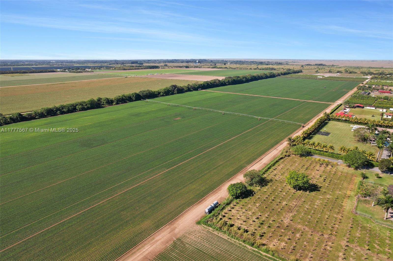 A rare opportunity to acquire 80 acres of prime agricultural land in unincorporated Miami-Dade County, just off Krome Avenue and SW 106th Street. The property consists of two contiguous parcels—one 50 acres and the other 30 acres—currently being farmed with soybeans as row crops. Zoned AU (Agricultural), the land allows for a variety of agricultural uses, including farming, nurseries, and equestrian facilities. With direct access via a private easement from Krome Avenue, the property is easily reachable while offering seclusion for farming or future land banking.