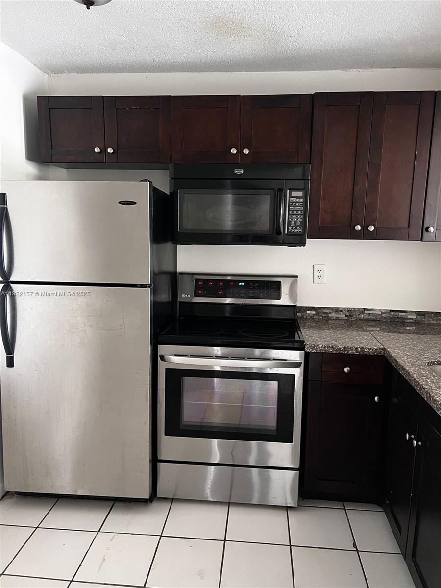 Spacious 1/1 in gated community of Montecarlo Condominium. The kitchen features wood cabinets, and granite counter tops. Laminated wood floors in living room and bedroom. Balcony. Bedroom has walk in closet. Pets allowed (restrictions may apply). Laundry facilities on each floor. Community features a pool, exercise room, management on-site, security patrol, security guard at gate 24/7. 1 assigned parking space. Additional spaces can be rented from Association. CORPORATE BUYER OK. No special assessments.