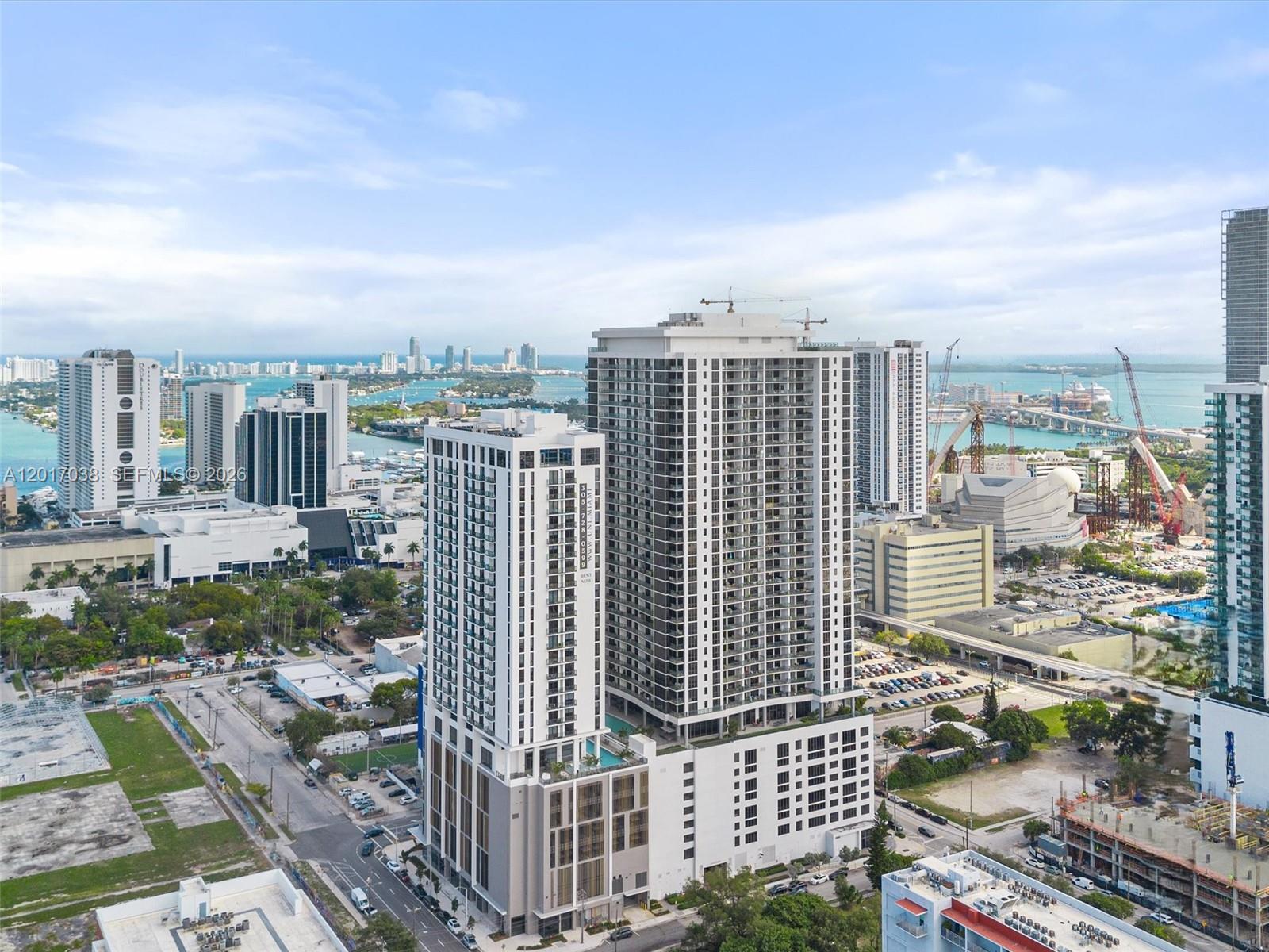 Experience stunning water views from this oversized 1 Bedroom + DEN, 1.5 Bathroom residence in the heart of Miami, offering unbeatable access to major highways, dining, shopping, and entertainment. Qualified buyers may purchase with as little as 3% DOWN, and the building features FULL RESERVES. HOA covers nearly everything for effortless living. Enjoy over 30,000 SQ FT of luxury resort-style amenities including 3 spectacular pools, jacuzzi, 3,000 SQ FT state-of-the-art fitness center, spa, sauna & treatment rooms, racquetball court, theater, social lounge, 24/7 indoor & outdoor security, concierge, on-site management, self-parking, and valet service. Incredible value in a prime location — motivated seller!
