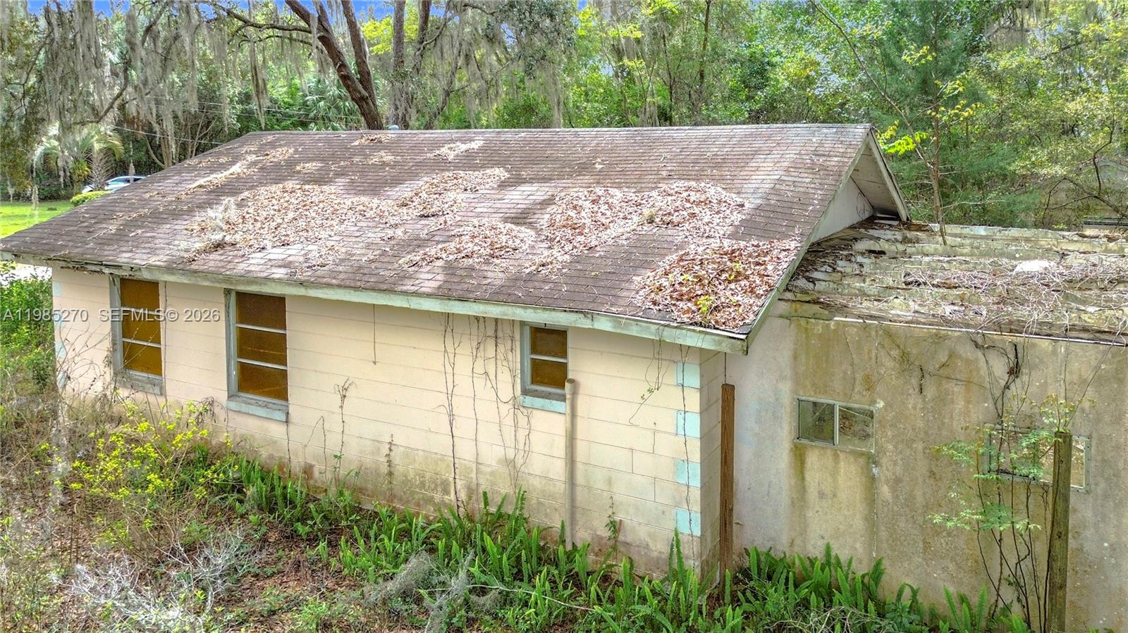 Investor special on 6.53 acres in Belleview! This 2-bedroom, 1-bath home offers 725 sq ft of living space. . Home needs full rehab or possible tear-down. Ideal for investors, builders, or buyers looking for land value with potential. Buyer to verify zoning, land use, measurements, and all property details with county. Build your custom home or personal retreat. Spacious A-1 zoned parcel with excellent potential. The property is conveniently located just minutes from shopping, dining, schools, and major corridors including US-441/27, providing easy access to Ocala and The Villages. With ample land and no HOA, this property presents an excellent opportunity for investors, rehabbed, or buyers looking to explore future development possibilities. Property sold AS-IS. Serious inquires only.