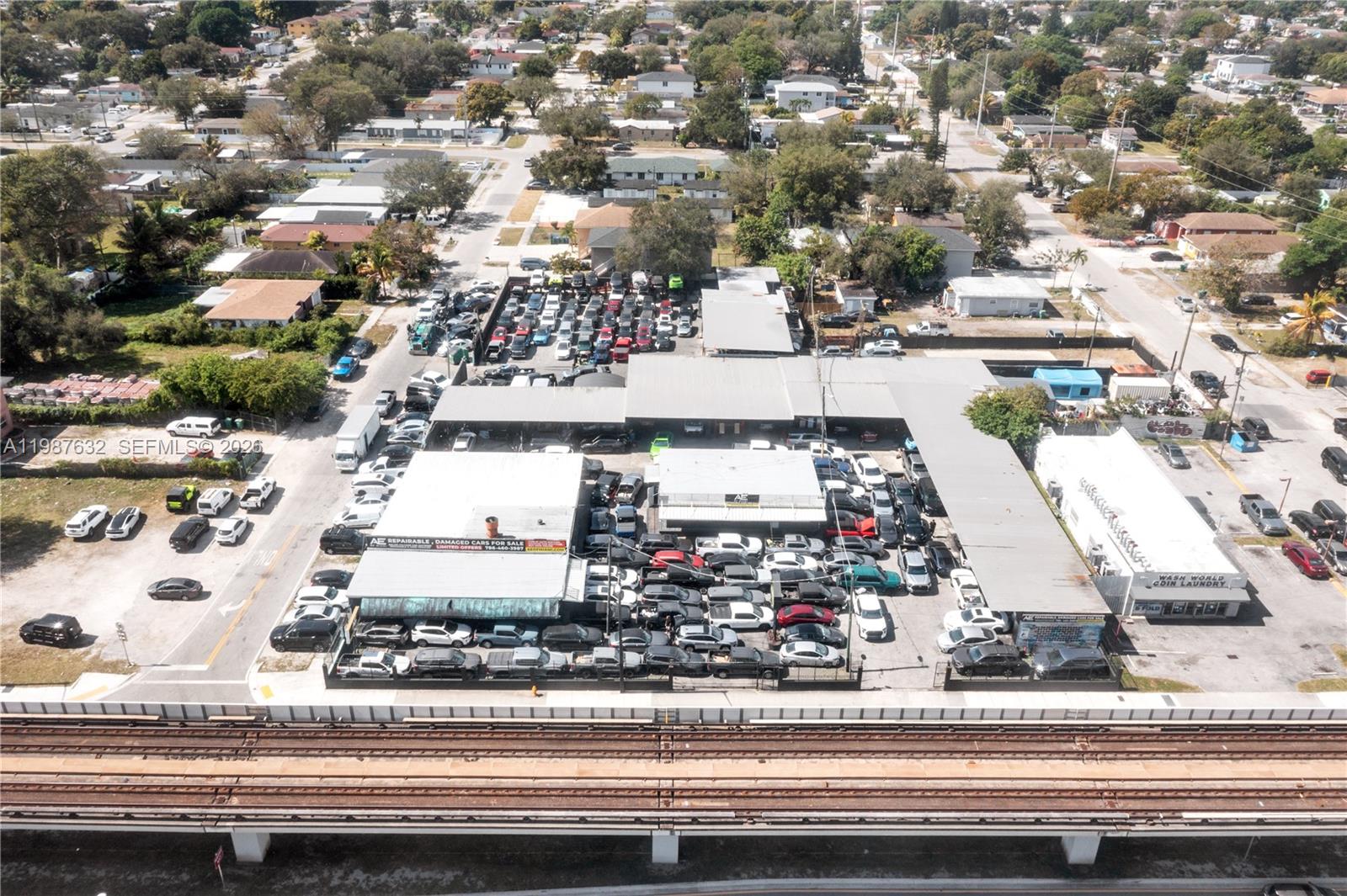 This unique property consists of 4,538 SF of building space plus over 15,500 SF of semi-enclosed work areas dedicated to automotive repairs, situated on a gated 1.38-acre lot zoned UC-MCS, allowing for a variety of uses including automotive, self-storage, multifamily up to 90 units per acre, or mixed-use development up to 10 stories. The property offers flexibility to continue as an automotive repair and export facility or redevelop into multifamily, commercial, or other urban uses. Perfect for a credit tenant - auto dealership (car/truck/boat), EV service center, self-storage facility, or mixed-use project. It is located near the MLK Metrorail station and the planned North Corridor transit line, making it an excellent candidate for transit-oriented development or commercial redevelopment. The property includes a large amount of automotive equipment. It is currently owner-occupied and can be delivered vacant.
Situated on a high-visibility stretch of NW 27th Avenue in the Model City neighborhood, the property is adjacent to emerging developments such as the 41-unit multifamily project in Model City and benefits from spillover growth from nearby Allapattah and Wynwood. The area is seeing significant investment, including the Dulce Vida mixed-income housing (230 units), Anatomia high-rise (499 units), and Rubell family apartments (330 units), enhancing long-term growth and investment potential along this corridor.